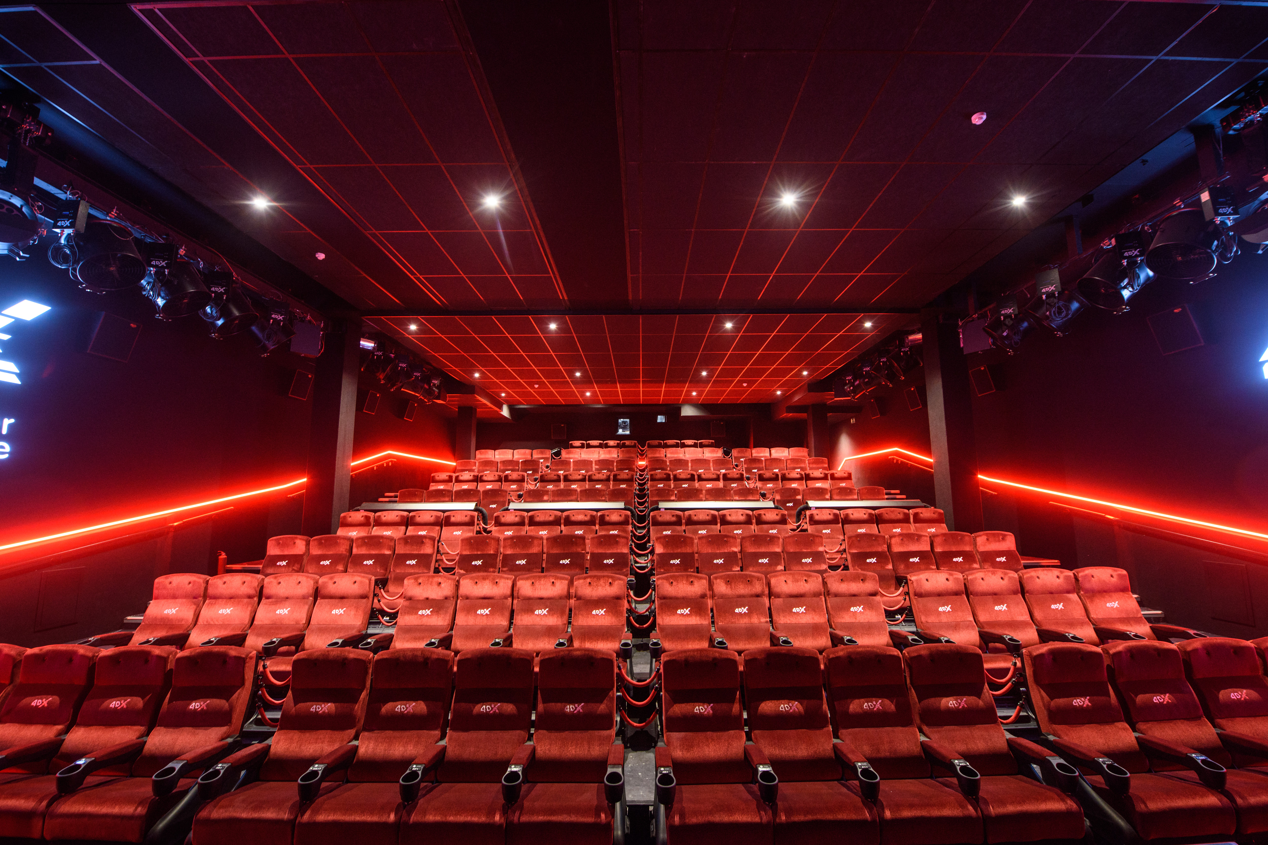 4DX theater at Cineworld Leicester Square with plush red seating for corporate events and screenings.