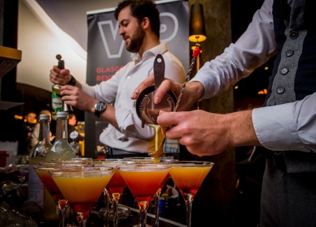 Cineworld O2 Greenwich bar scene with bartenders crafting vibrant cocktails for events.