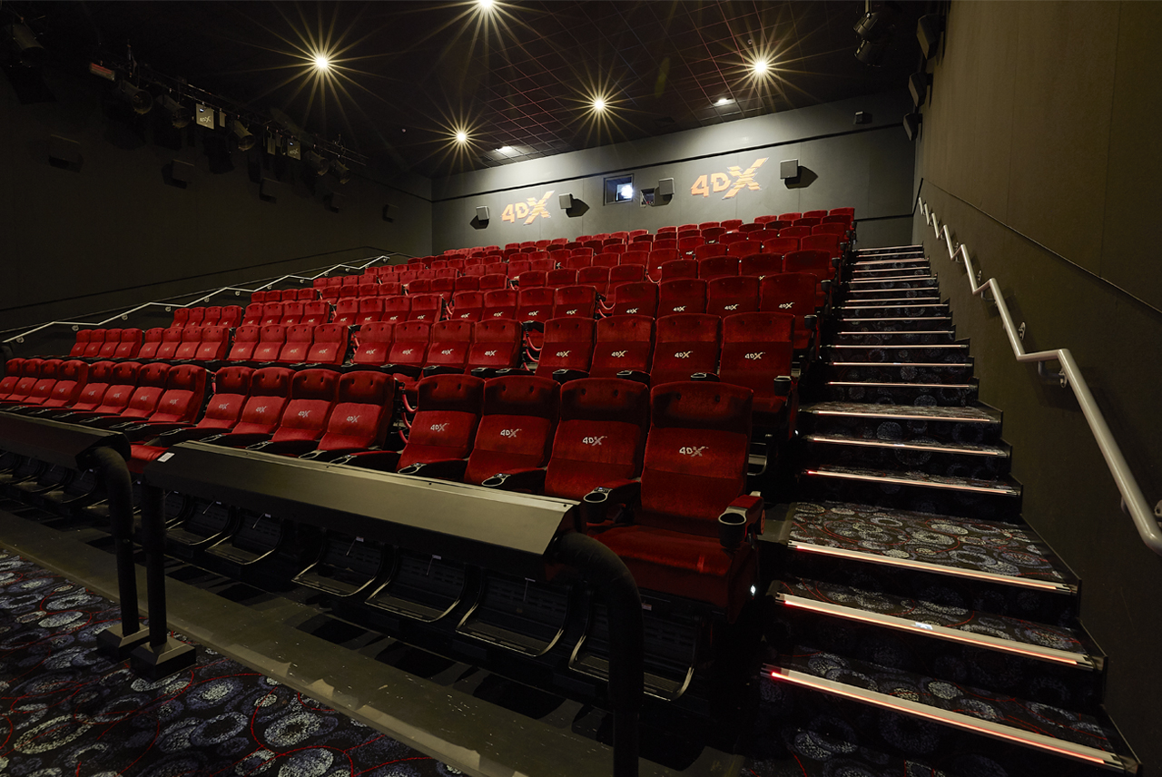 4DX theater with plush red seating at Cineworld Birmingham for immersive film screenings.