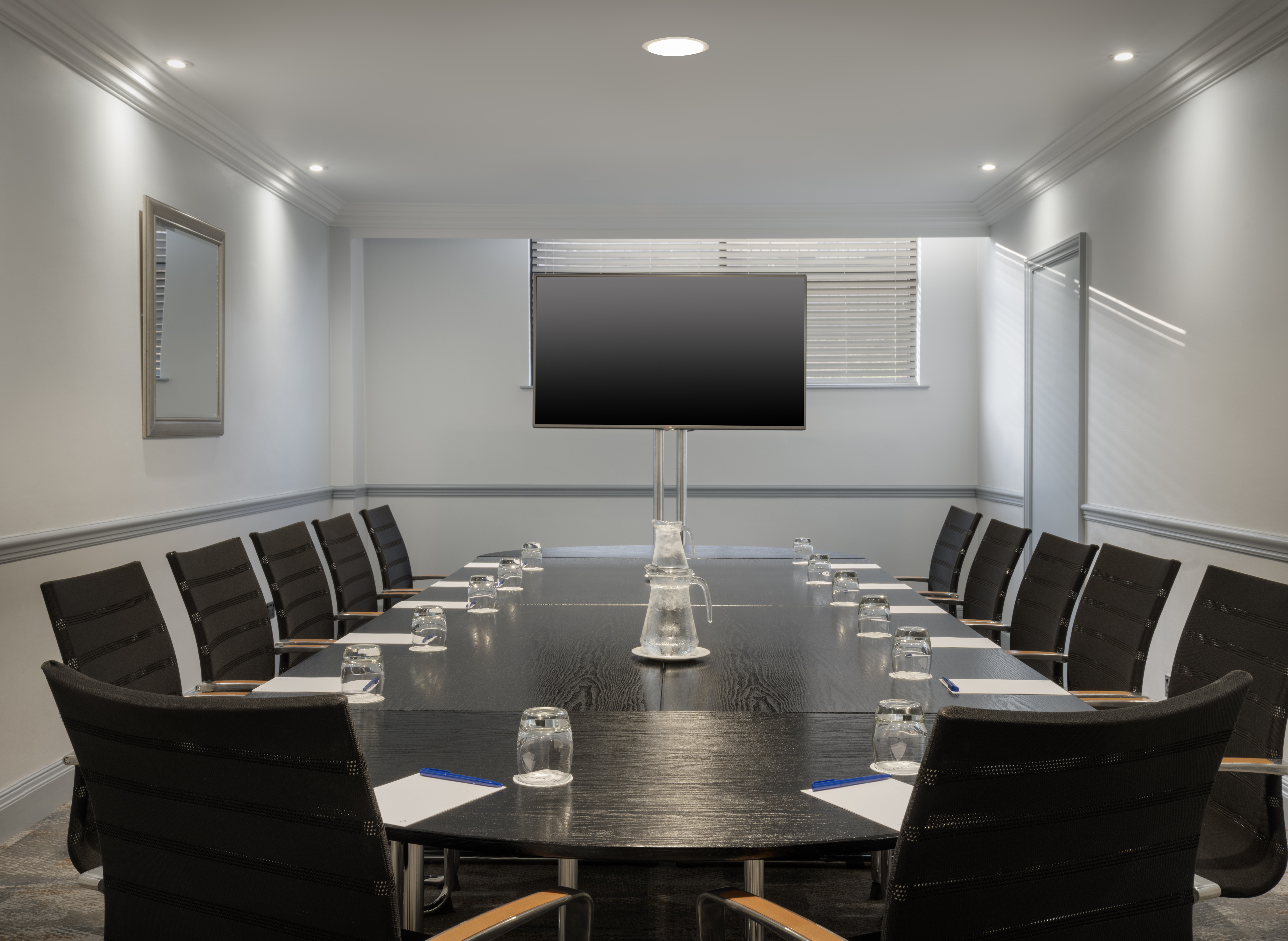 Modern conference room at Delta Hotels Liverpool with ergonomic chairs for meetings.