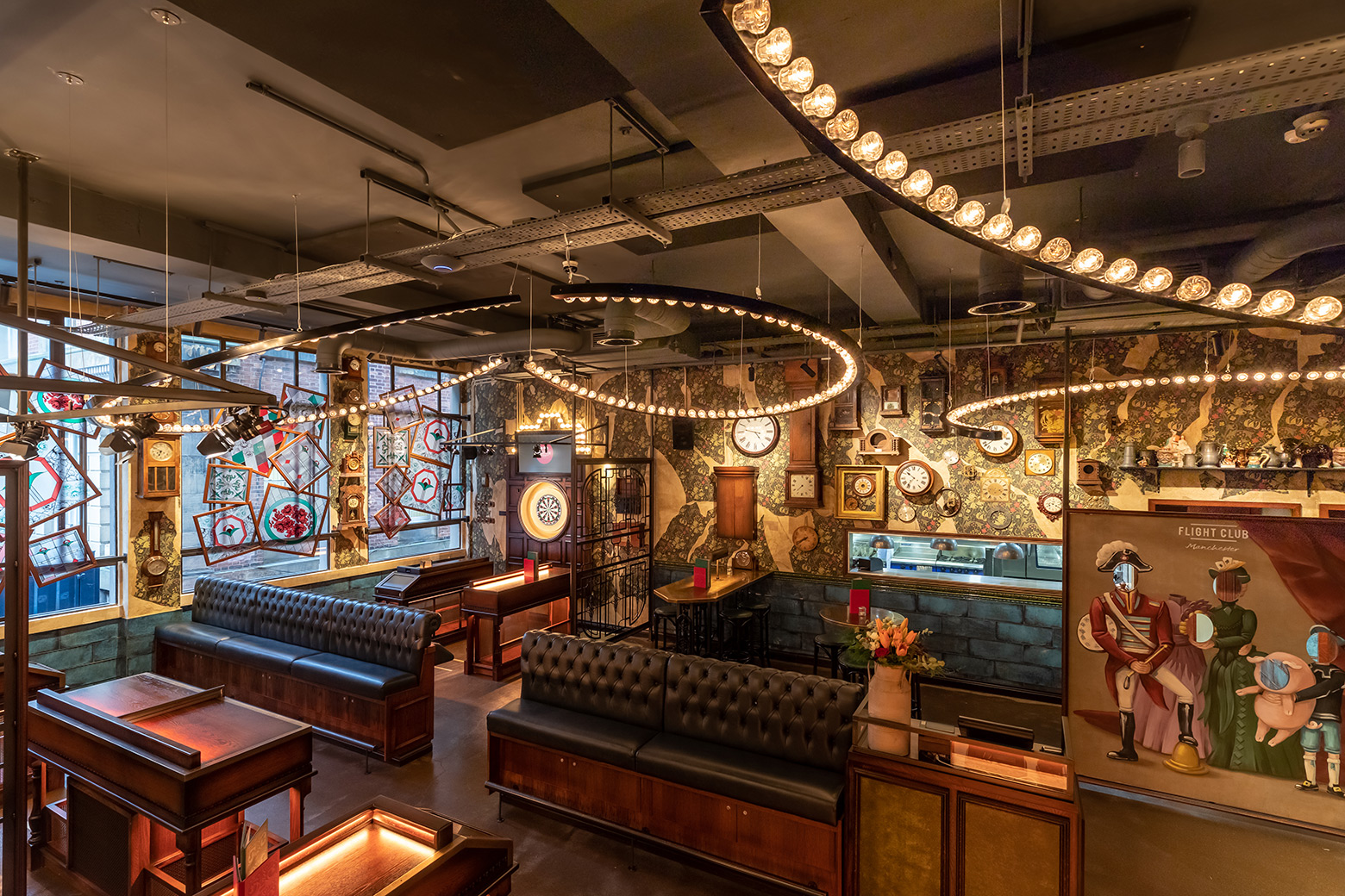 Stylish event space at Flight Club Manchester with vintage decor, perfect for gatherings.