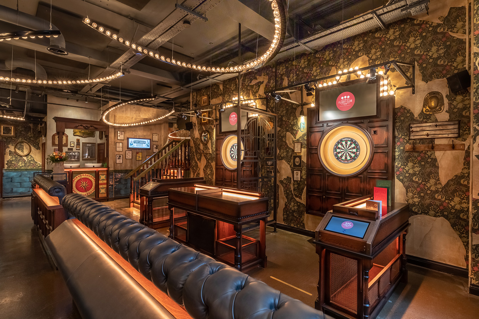 Vibrant event space at Flight Club Manchester with dartboards for networking and team-building.