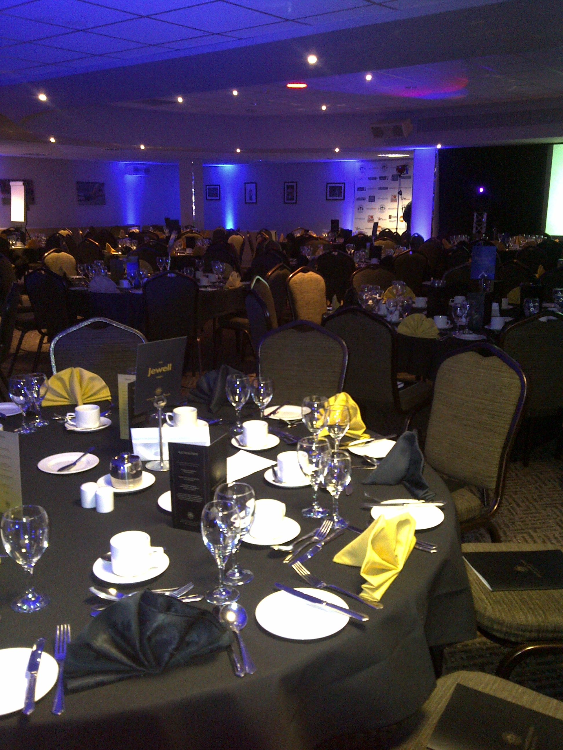 Elegant banquet table in DW Sports Fitness Lounge for formal events and networking.
