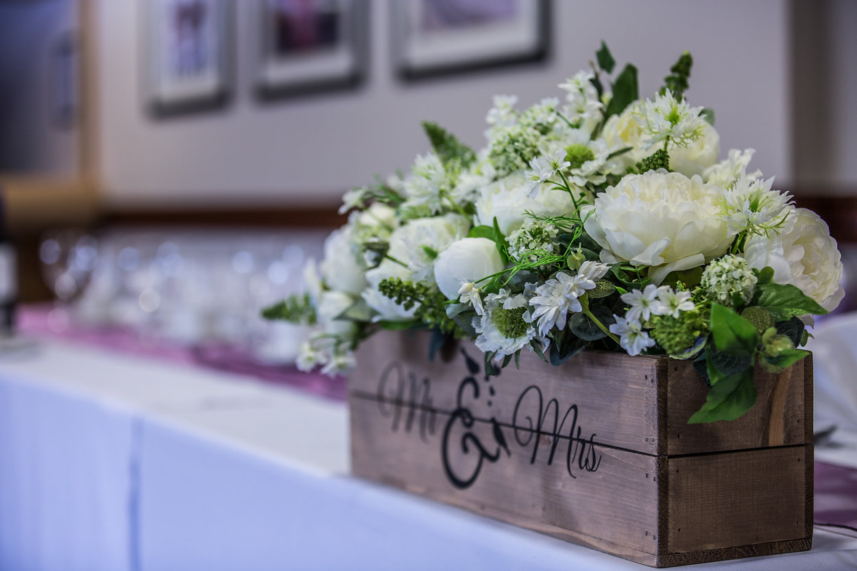 Floral centerpiece in rustic box for weddings at Phoenix Lounge, DW Stadium.