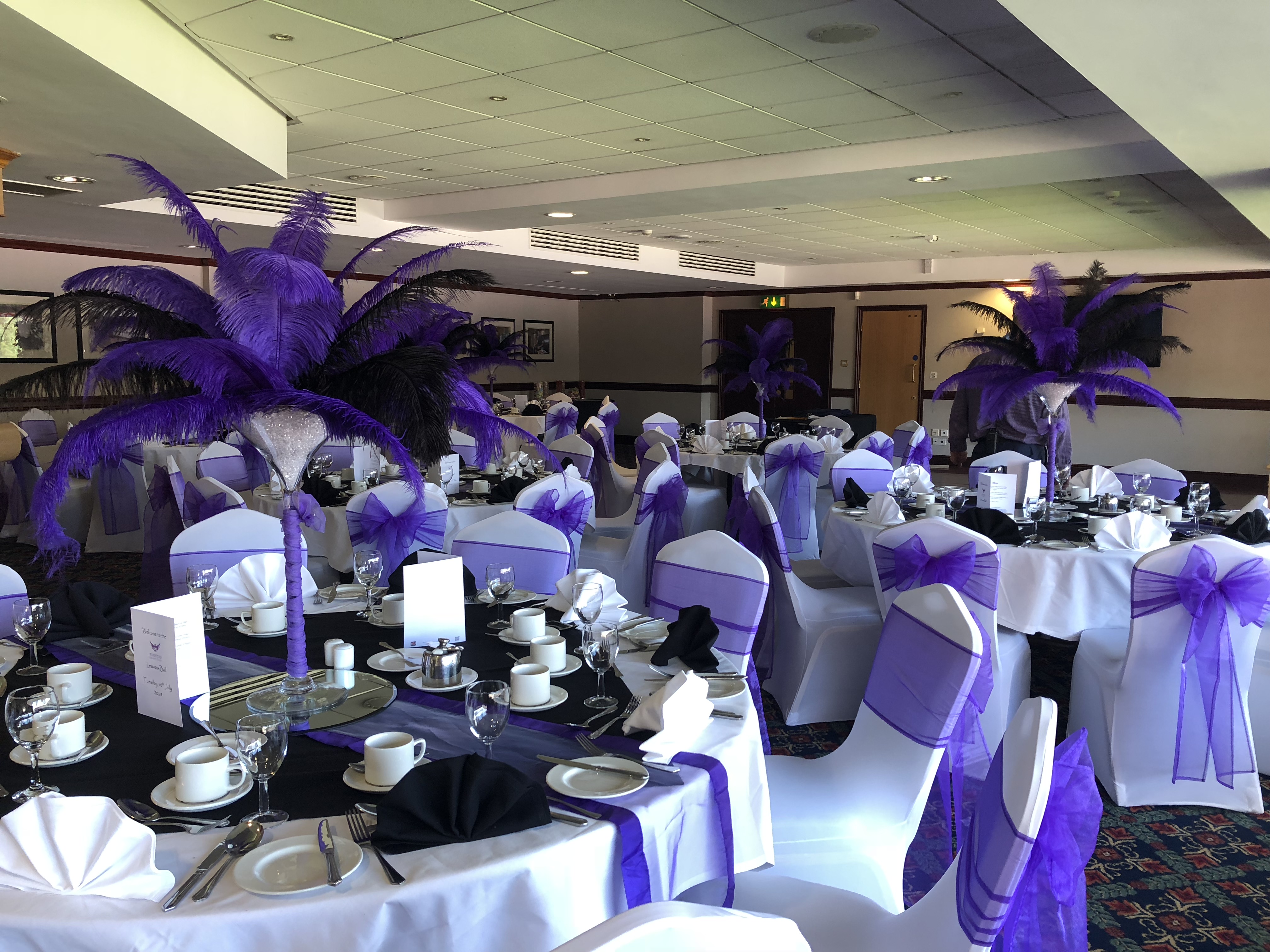 Elegant Phoenix Lounge event space with black and white tables, perfect for weddings and corporate events.