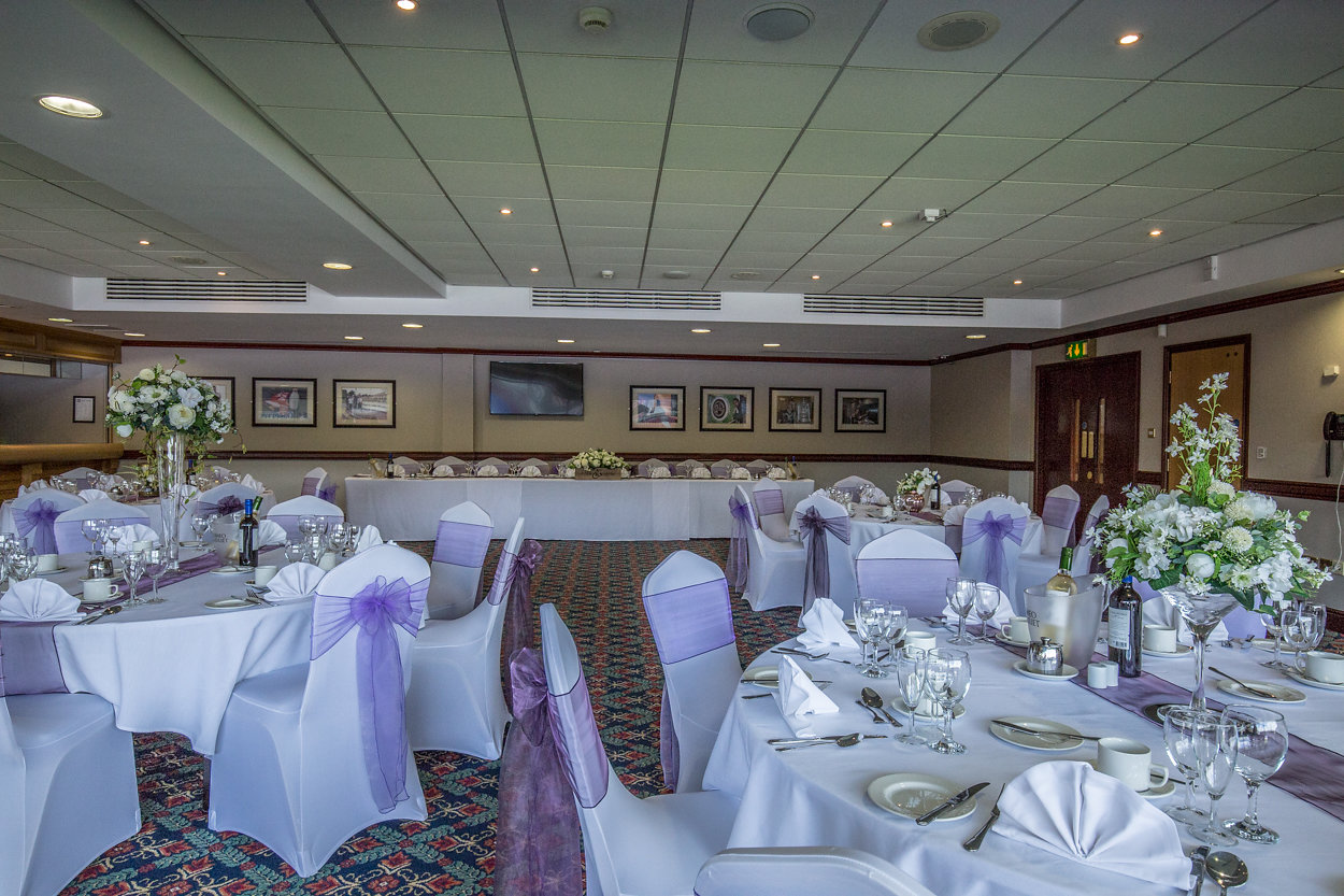 Elegant Phoenix Lounge event space with white linens, perfect for weddings and gatherings.