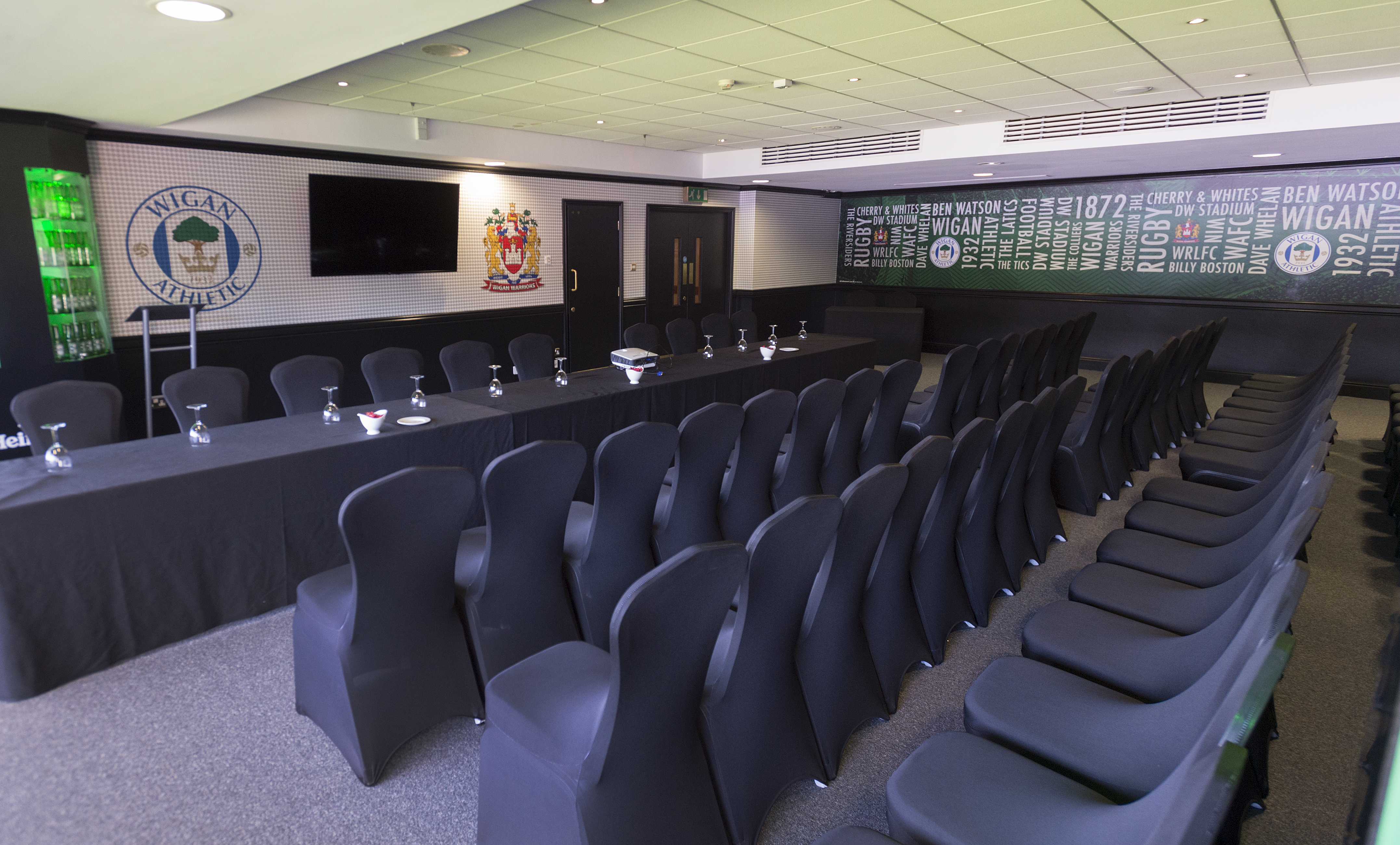 Carling Lounge meeting room at DW Stadium, modern decor for corporate events.