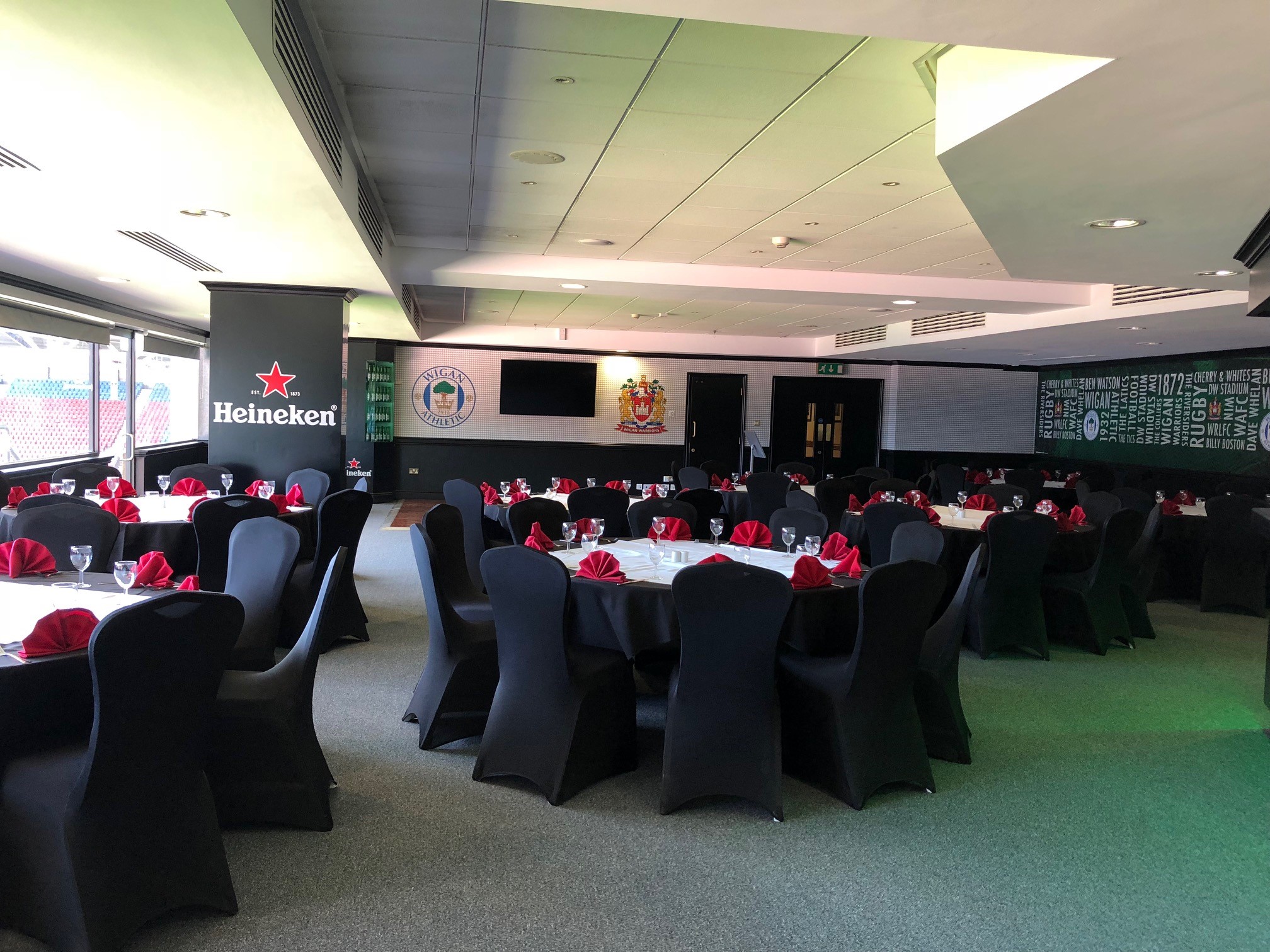 Elegant event space at The Carling Lounge with round tables for corporate gatherings.