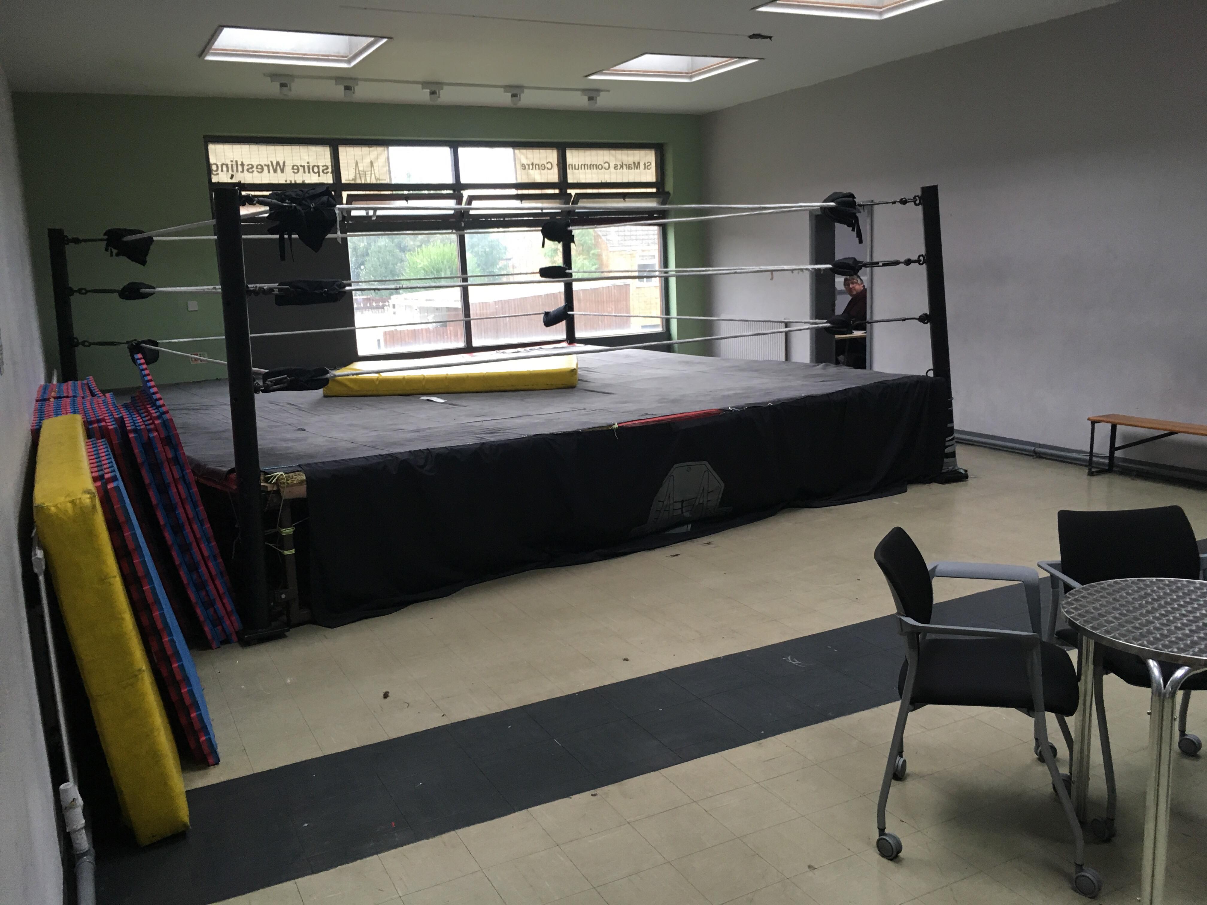 Large hall with wrestling ring at St. Mark's Community Centre for events and fitness classes.