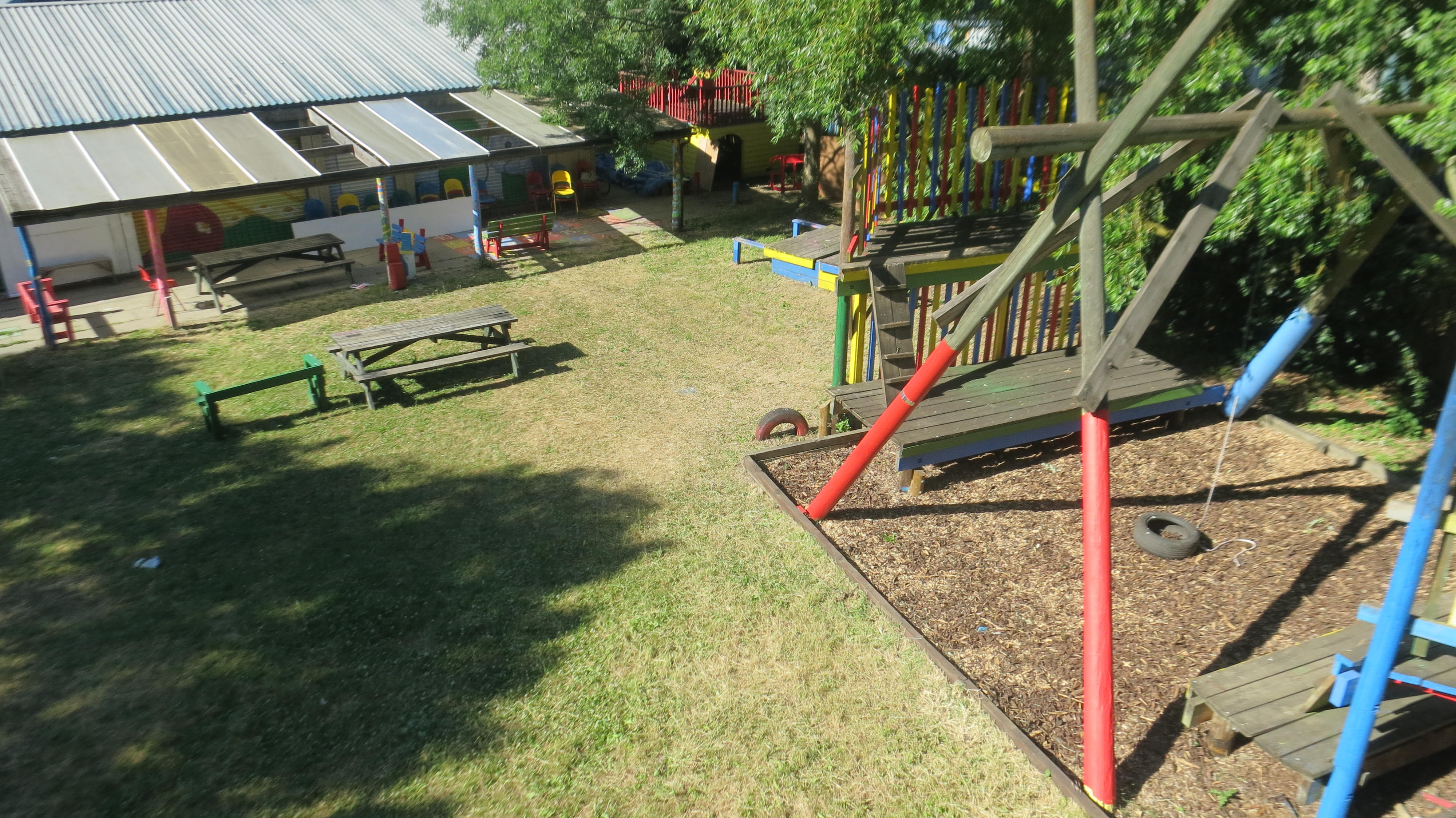 Vibrant outdoor playground with colorful equipment, ideal for team-building events.