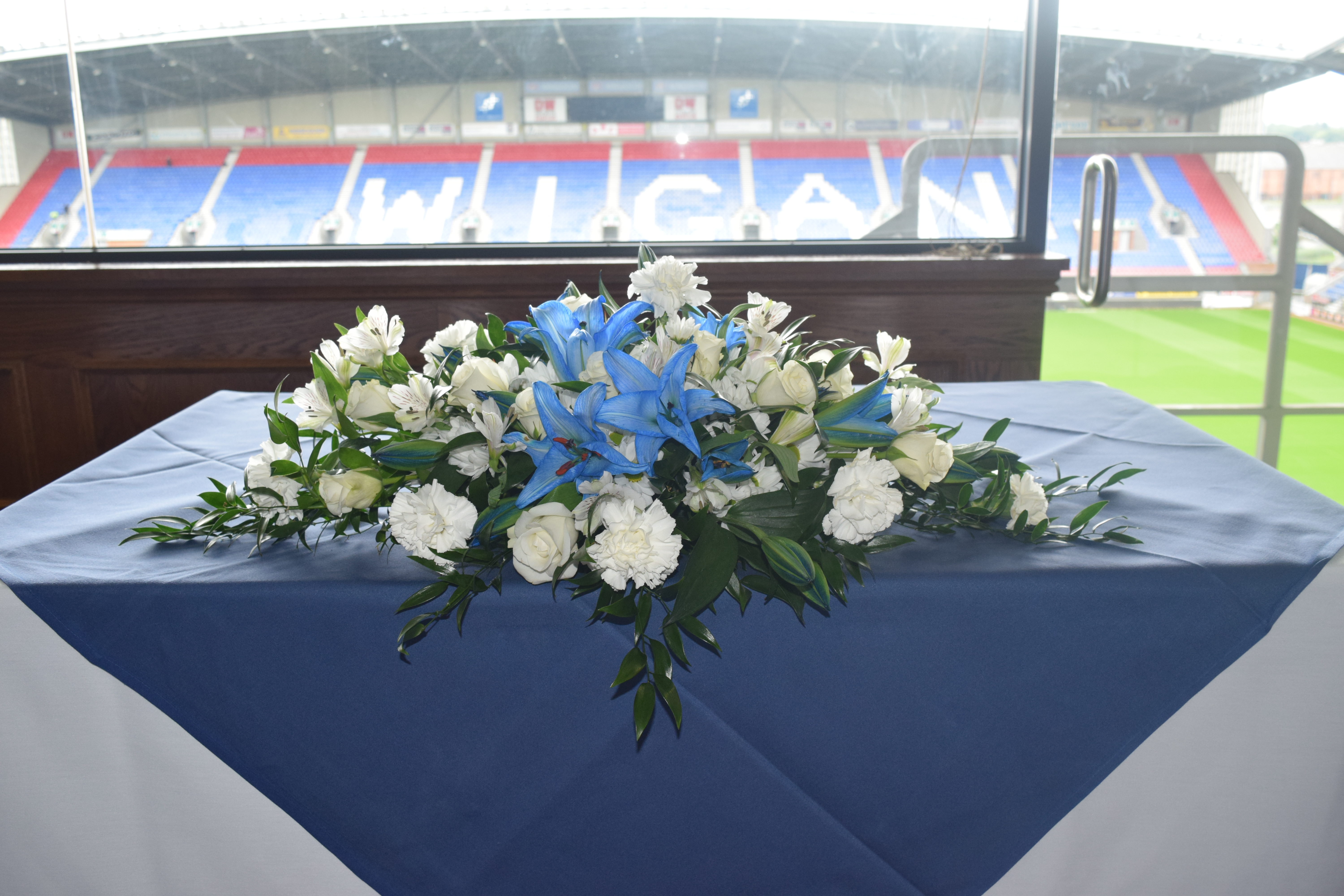 Floral centerpiece in DW Stadium's President's Suite for corporate events and celebrations.