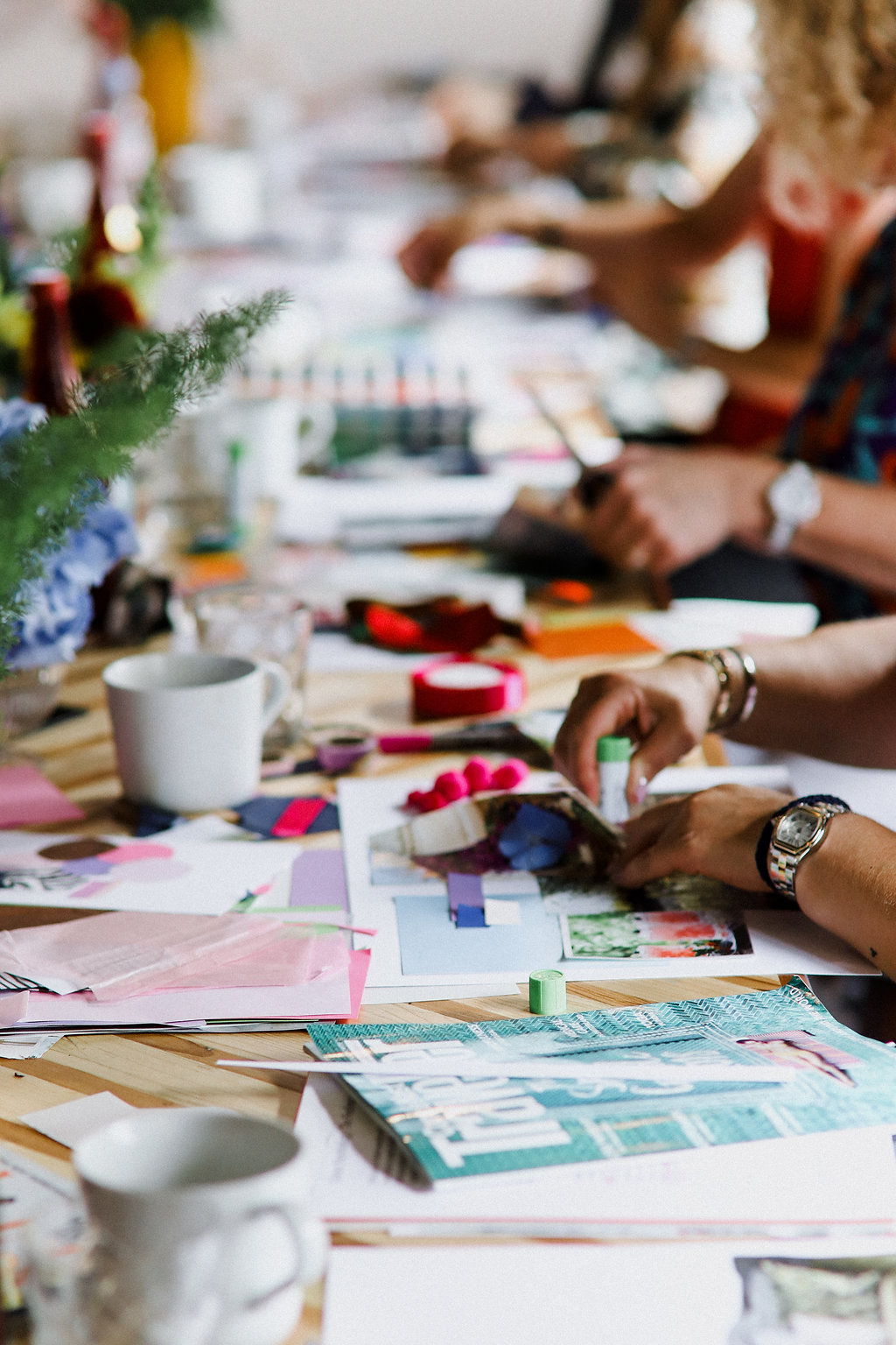 Creative brainstorming session at The Vine Club Brighton with mood boards and materials.