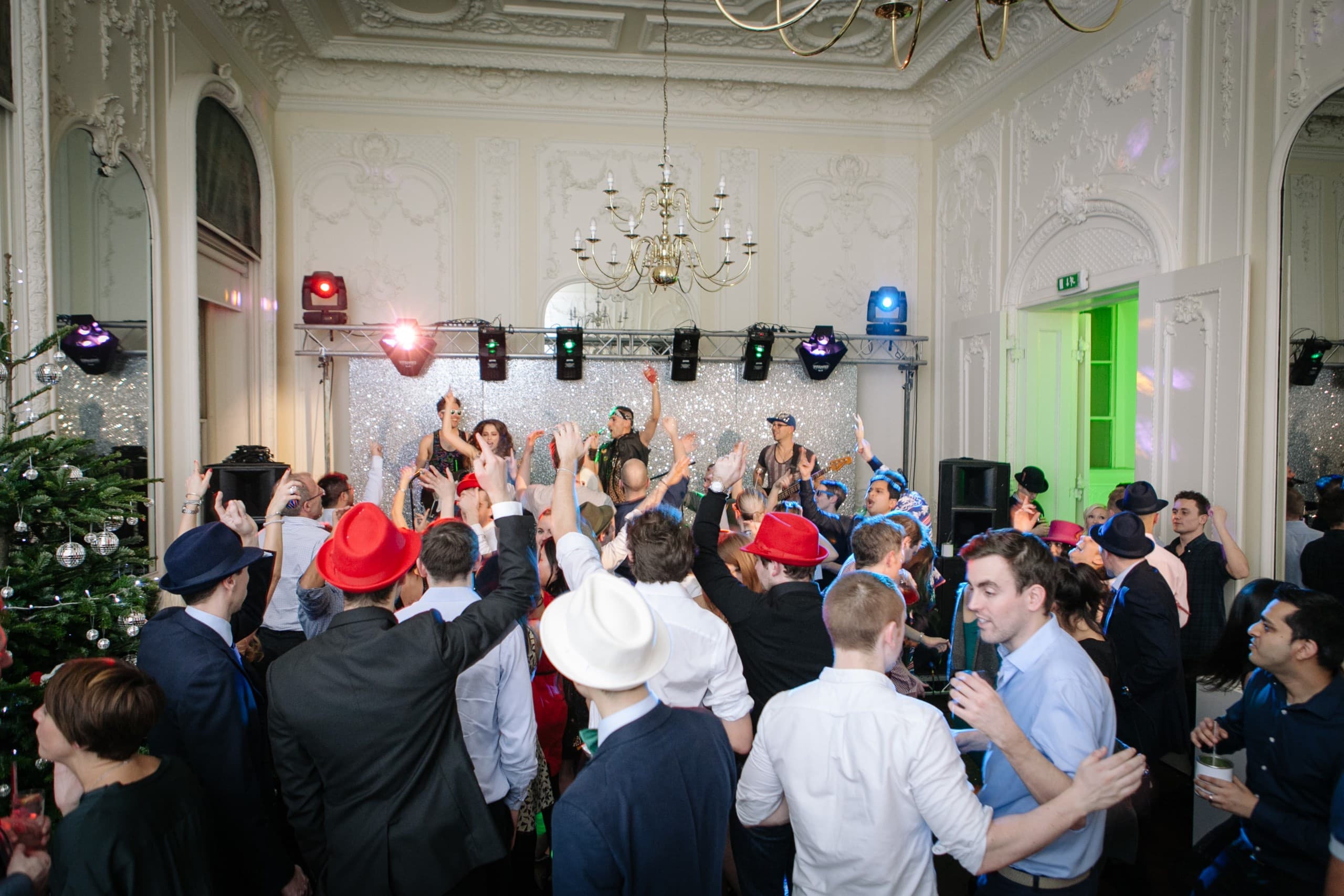 Christmas gala party in Westminster with festive decor and stage lighting for corporate events.