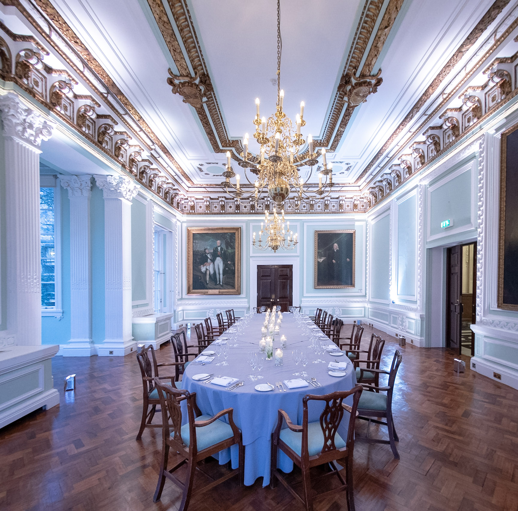 Elegant Christmas party venue with chandelier at Carlton House Terrace, Westminster.