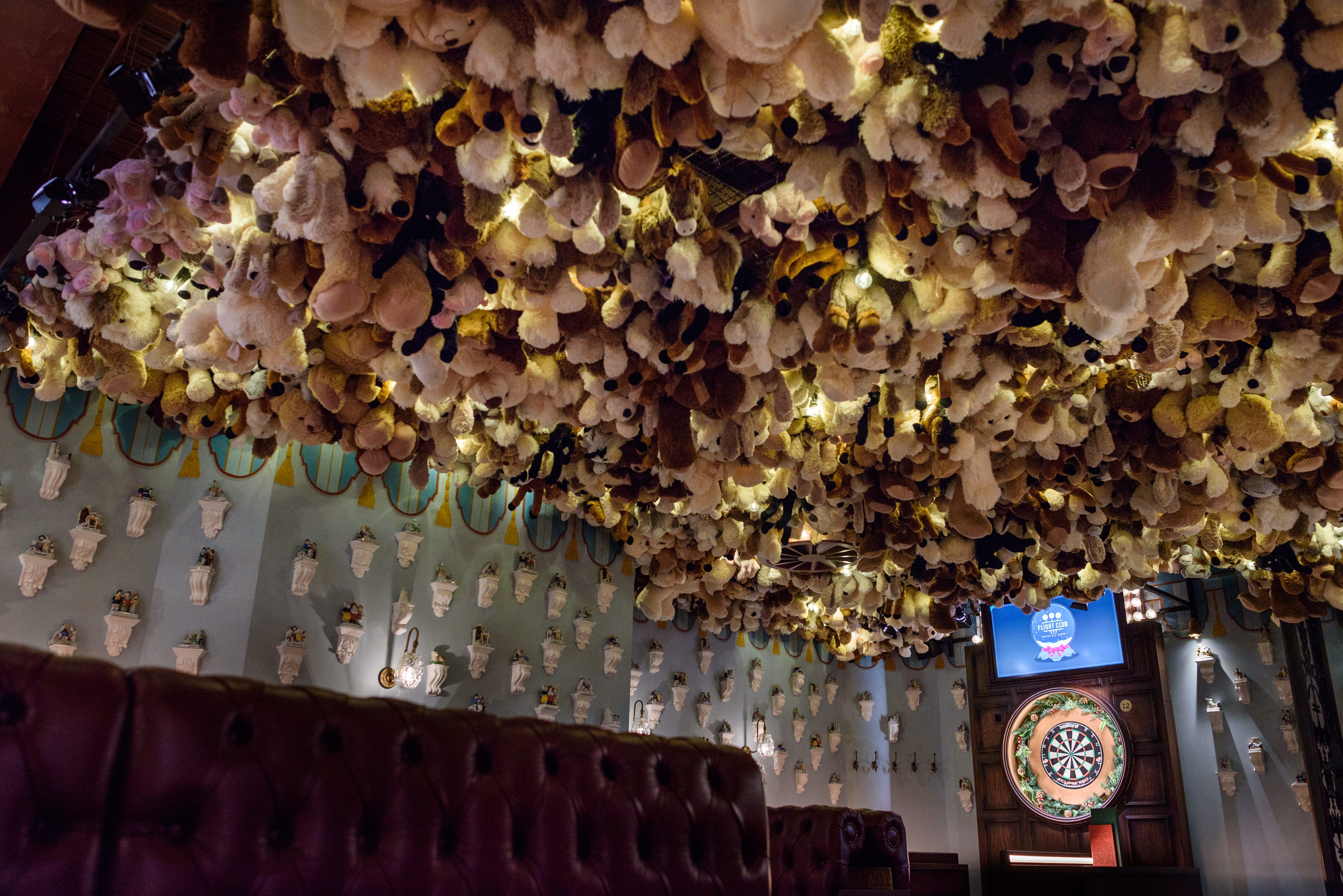 Funfair venue with plush toy ceiling, ideal for team-building and networking events.