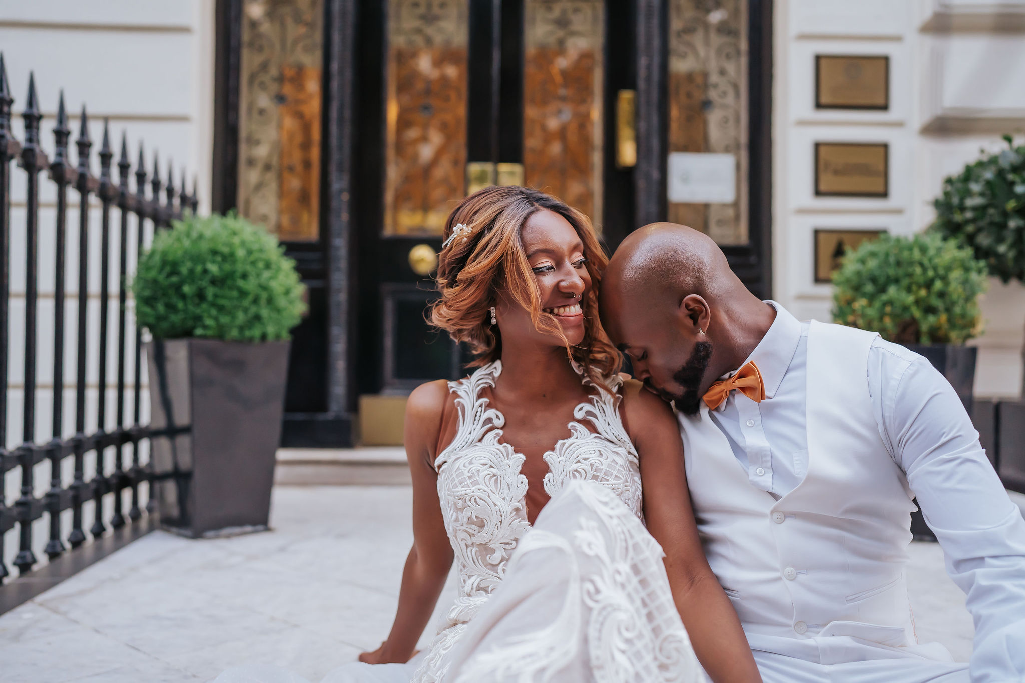 Joyful couple at a wedding in elegant venue, capturing love and celebration moments.