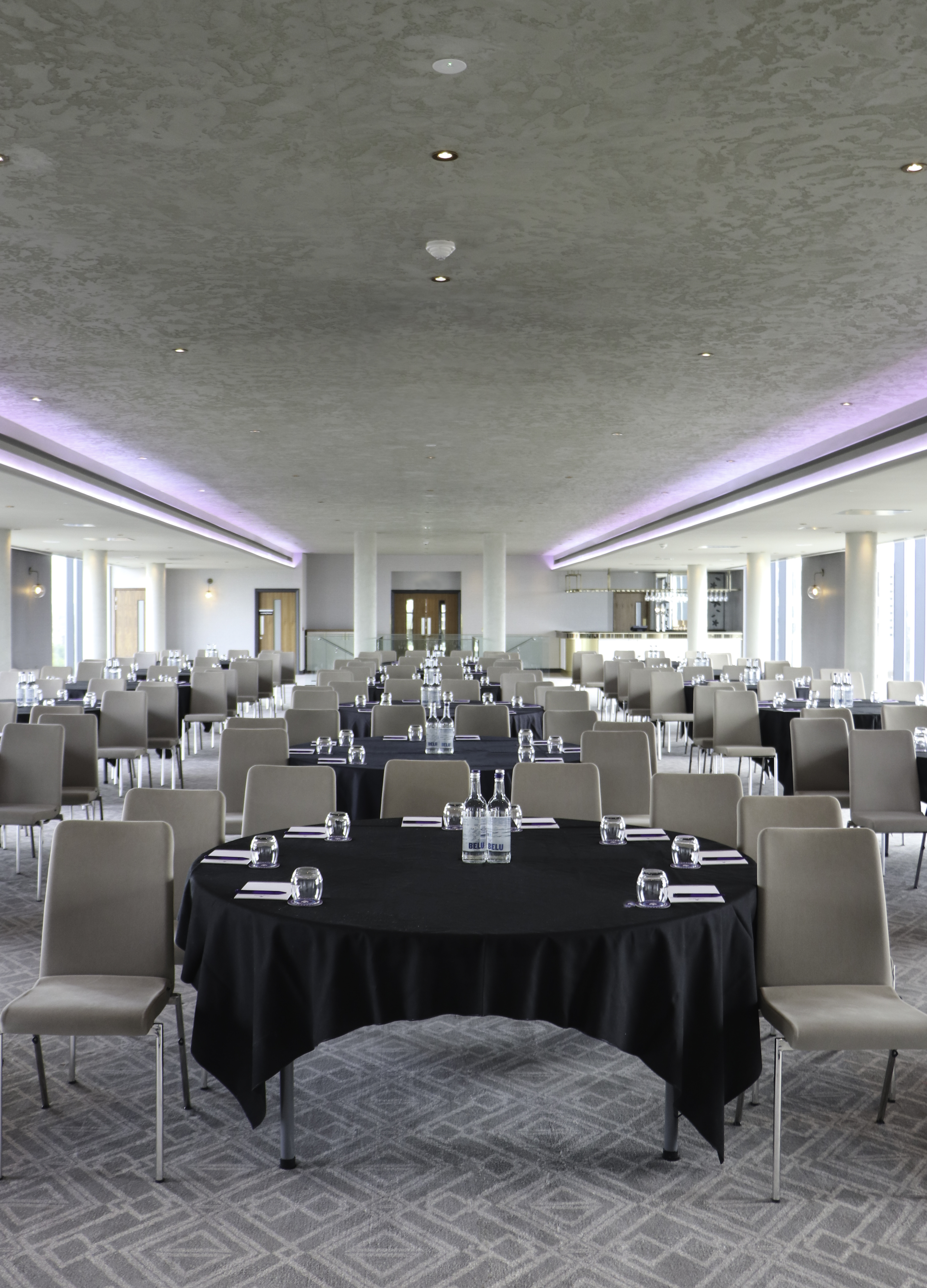 Sky Gallery event space in Birmingham, set for a modern conference with round tables.