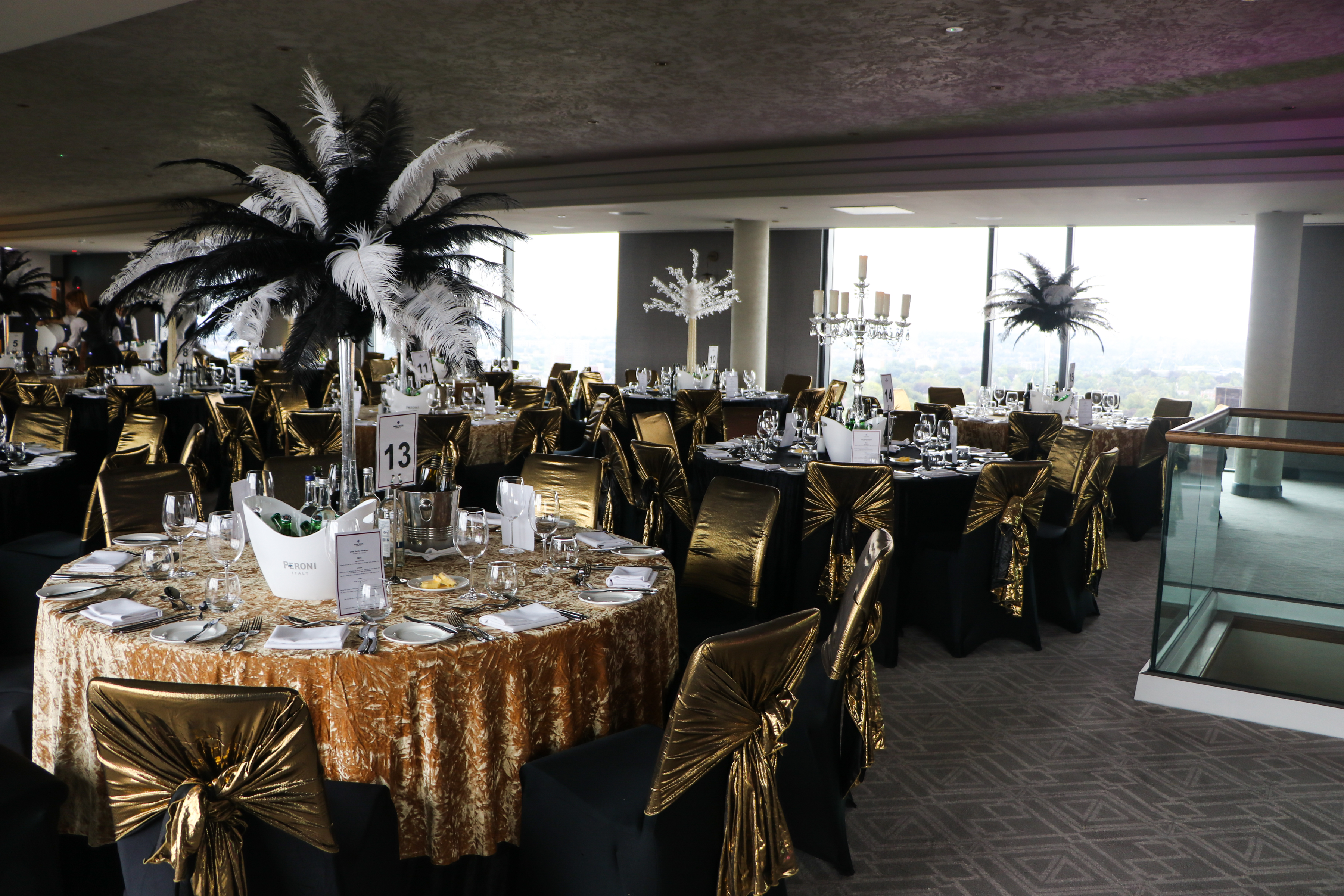 Elegant event space at Sky Gallery, featuring gold decor and stunning views for upscale gatherings.