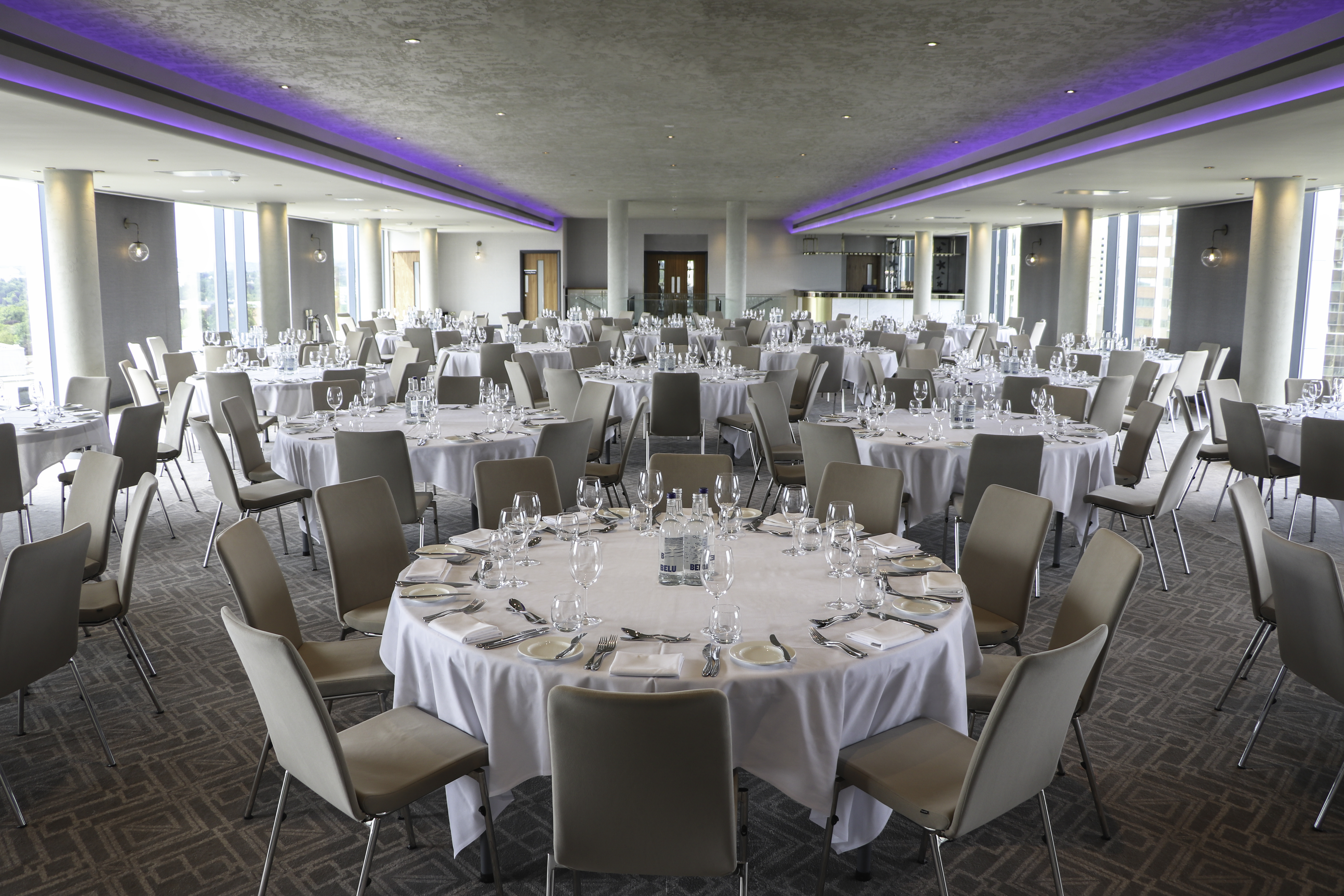 Sky Gallery event space in Park Regis Birmingham, set for a formal dinner with elegant tables.