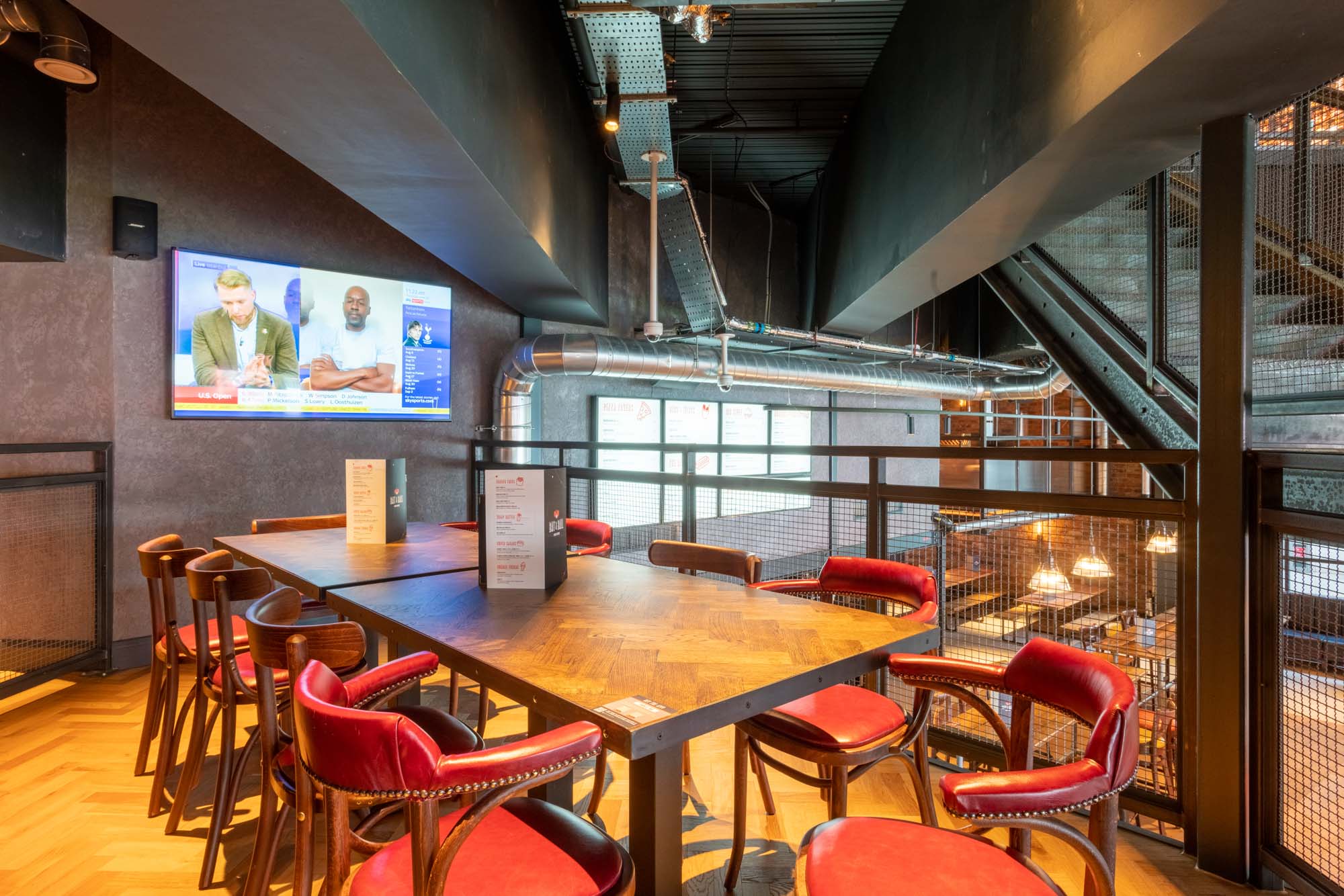 Modern event space with high-top table for corporate parties and conferences in Bat & Ball.