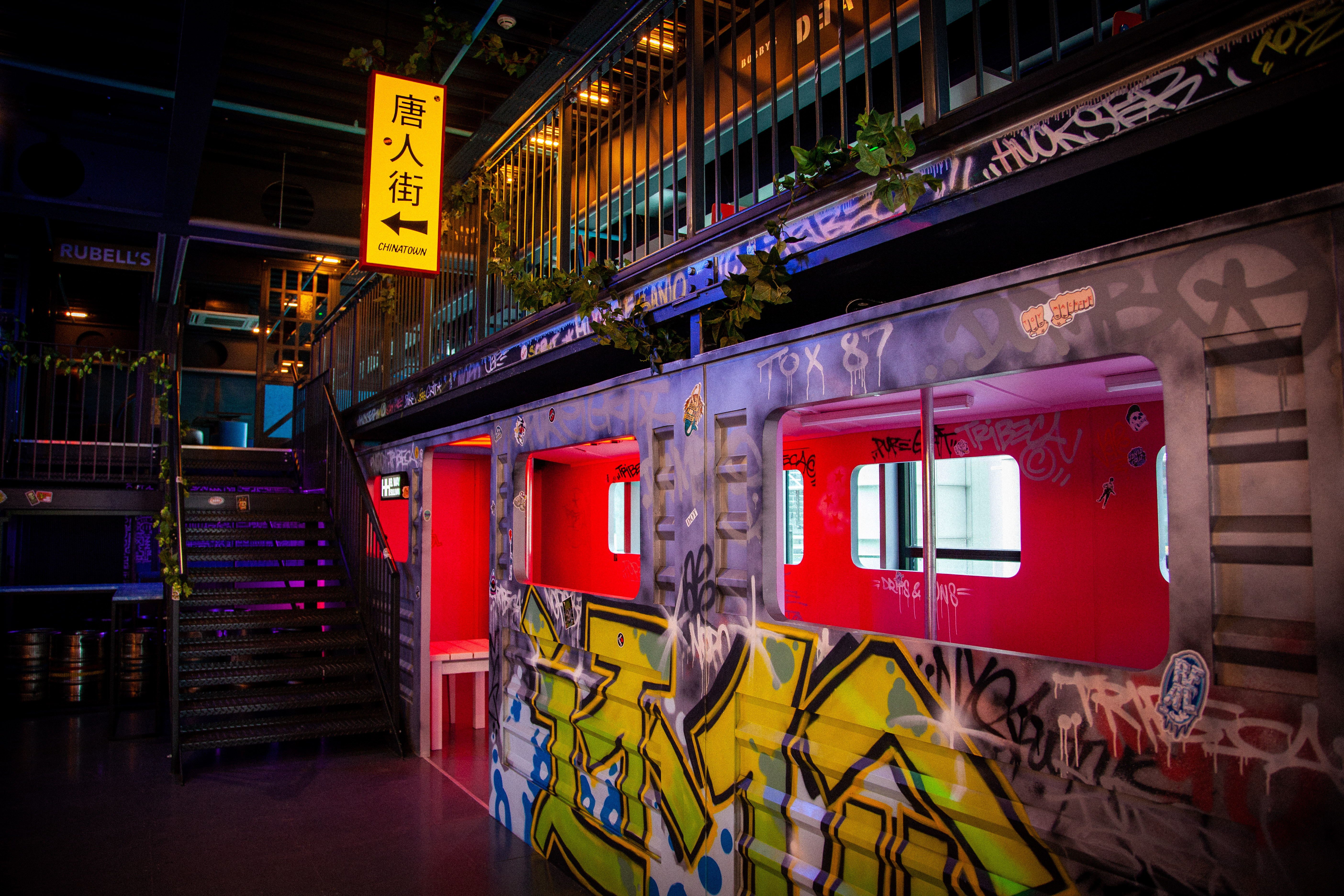 Vibrant industrial venue with graffiti art for creative events in HUCKSTER London.