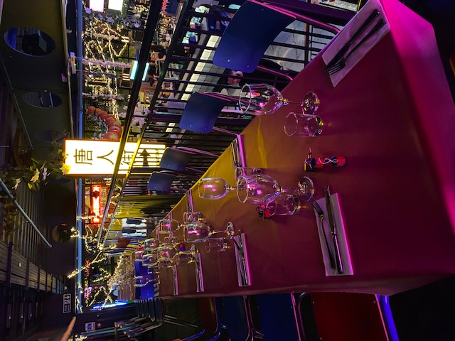 High Line dining setup with colorful lighting for intimate gatherings or corporate events.