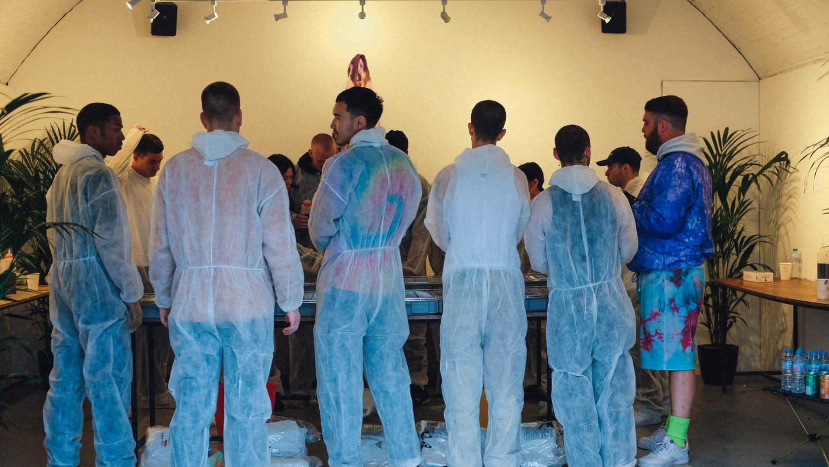 Participants in protective gear at The Sassoon Gallery workshop for team-building events.
