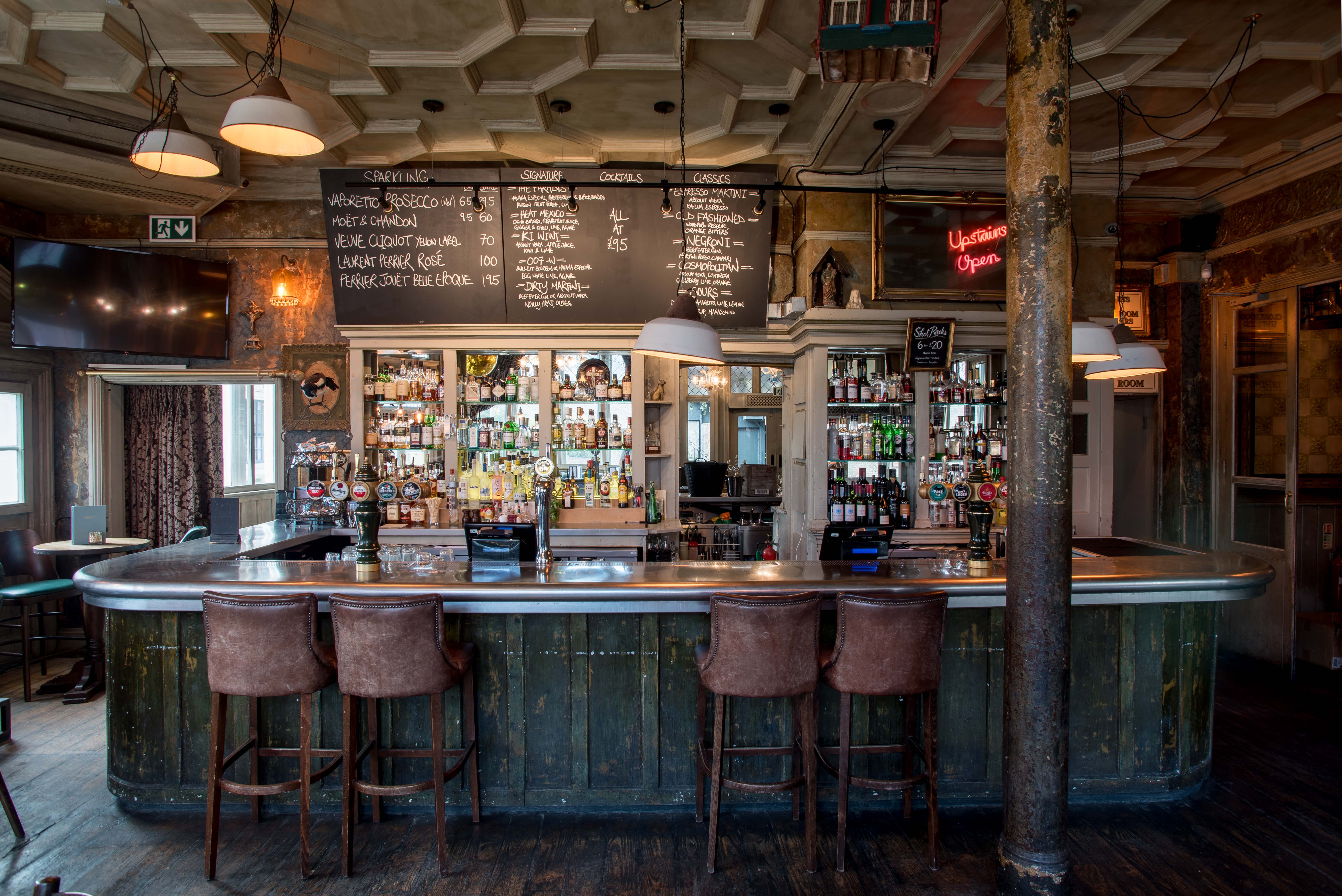 Stylish bar at First Floor in Paradise, ideal for networking and social gatherings.