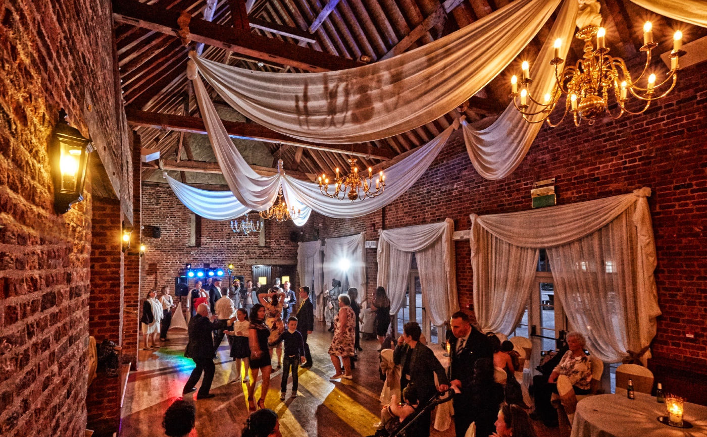 Elegant event space with chandeliers, perfect for weddings and upscale gatherings.