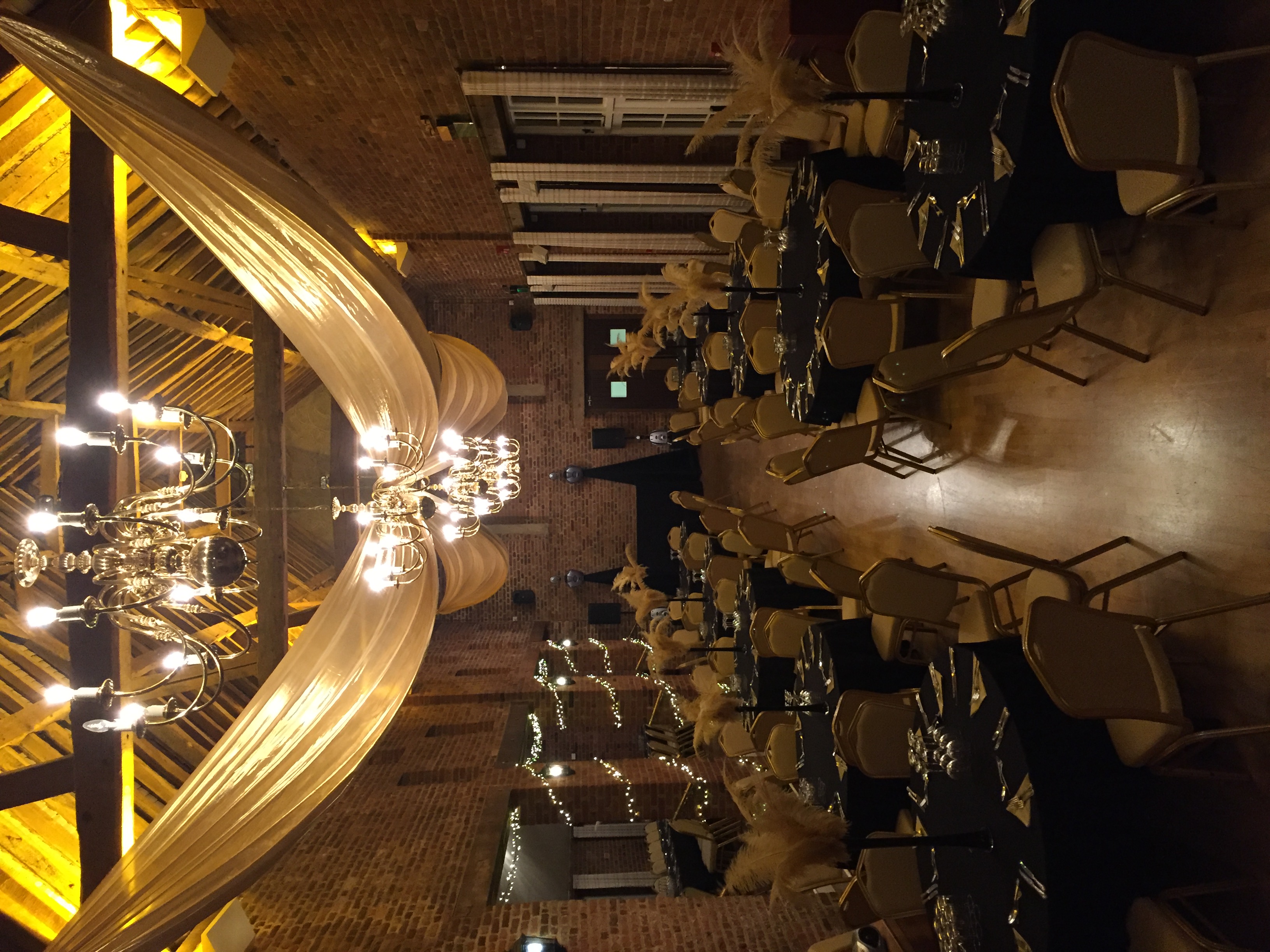 Elegant round tables with black and gold decor at Forty Hall Christmas event.
