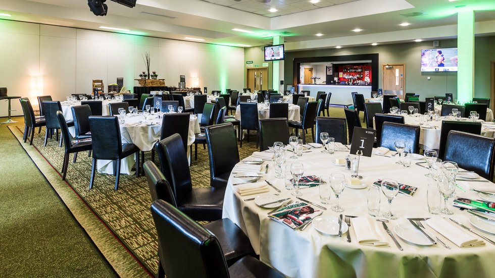 Premiership Suite at Leicester Tigers Stadium set for a formal dinner event.