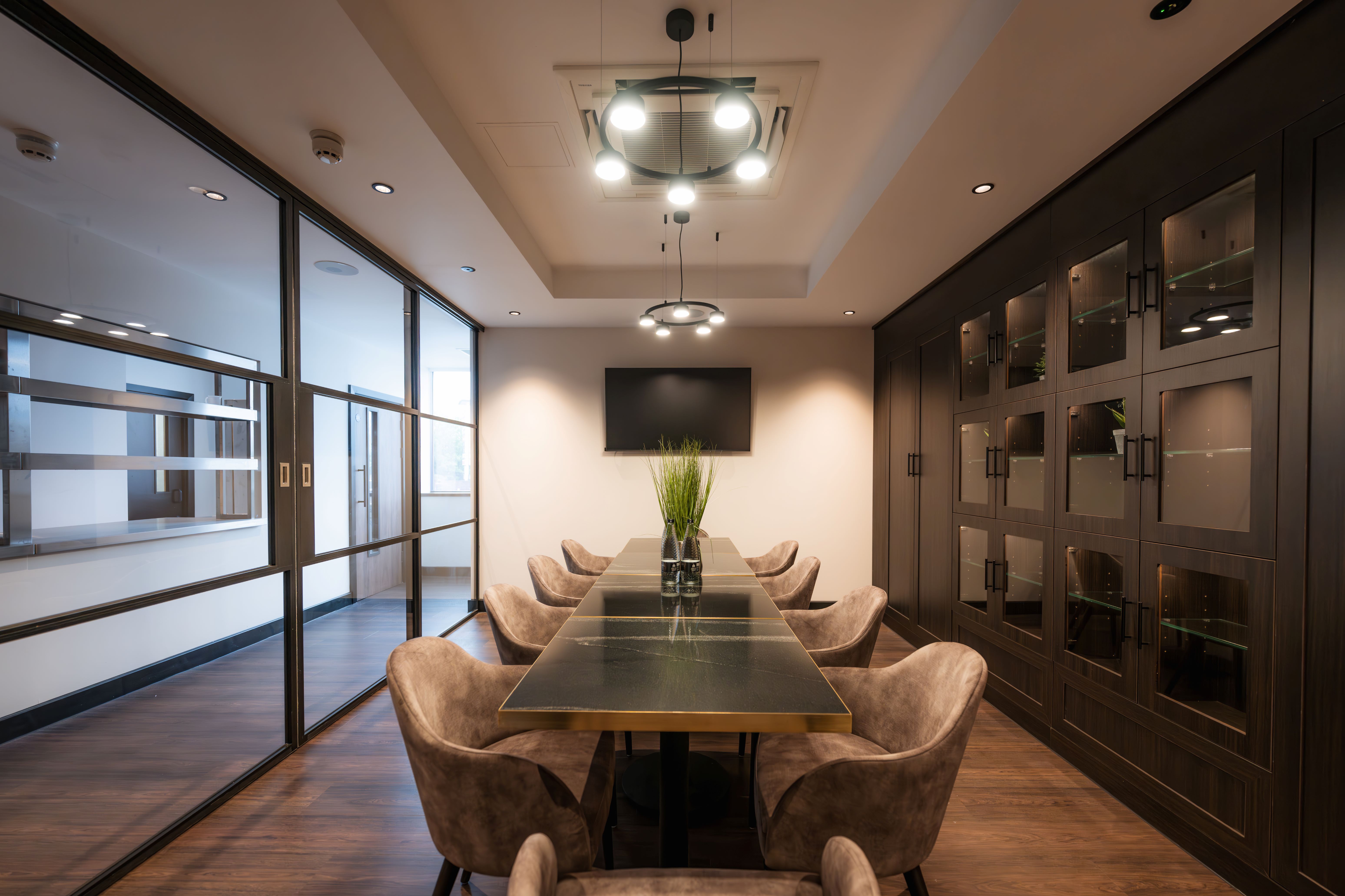 Modern meeting room at Birmingham City FC with sleek table, ideal for corporate events.