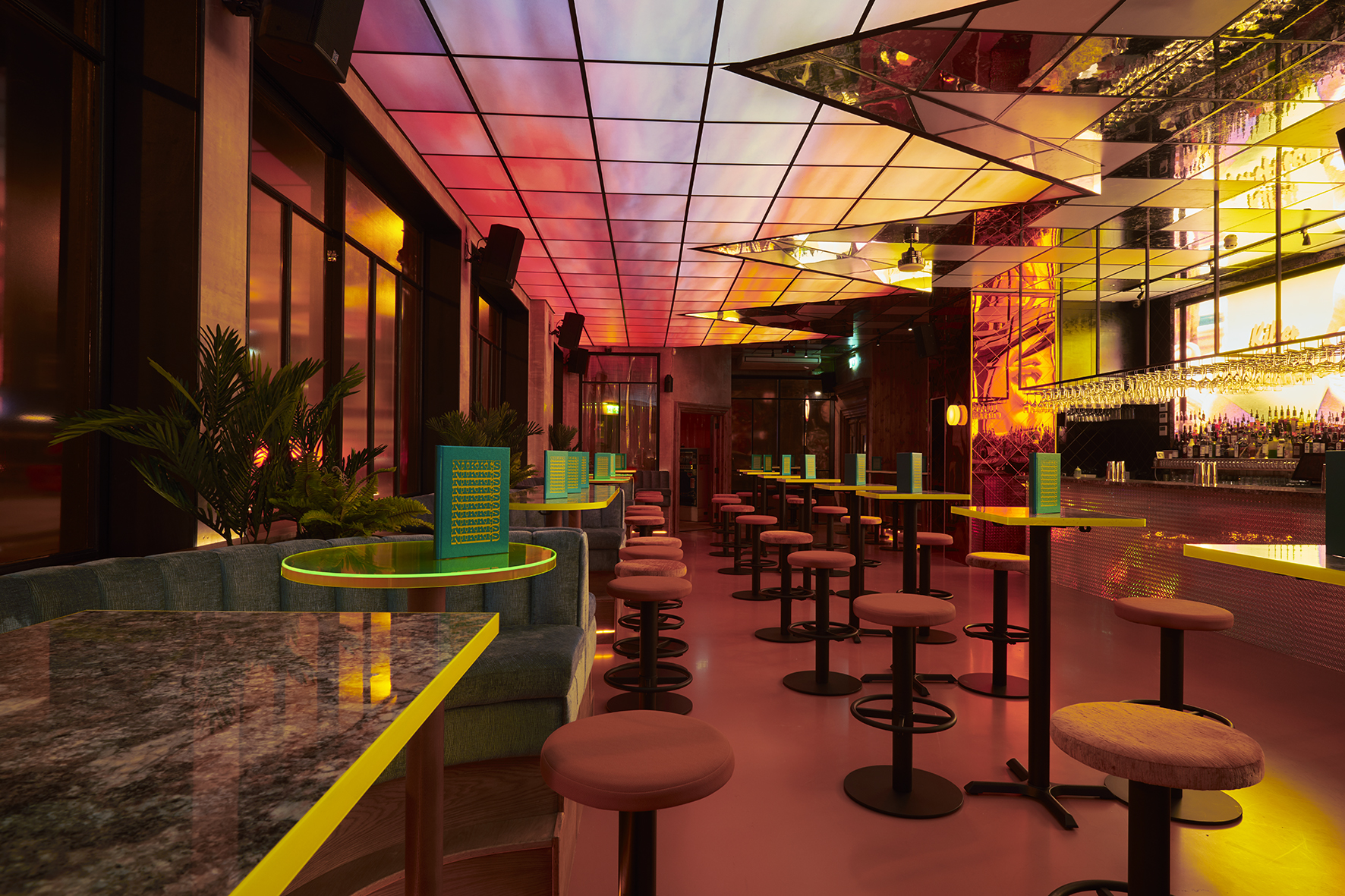 Vibrant modern event space at Nikki's with colorful lighting for cocktail receptions.