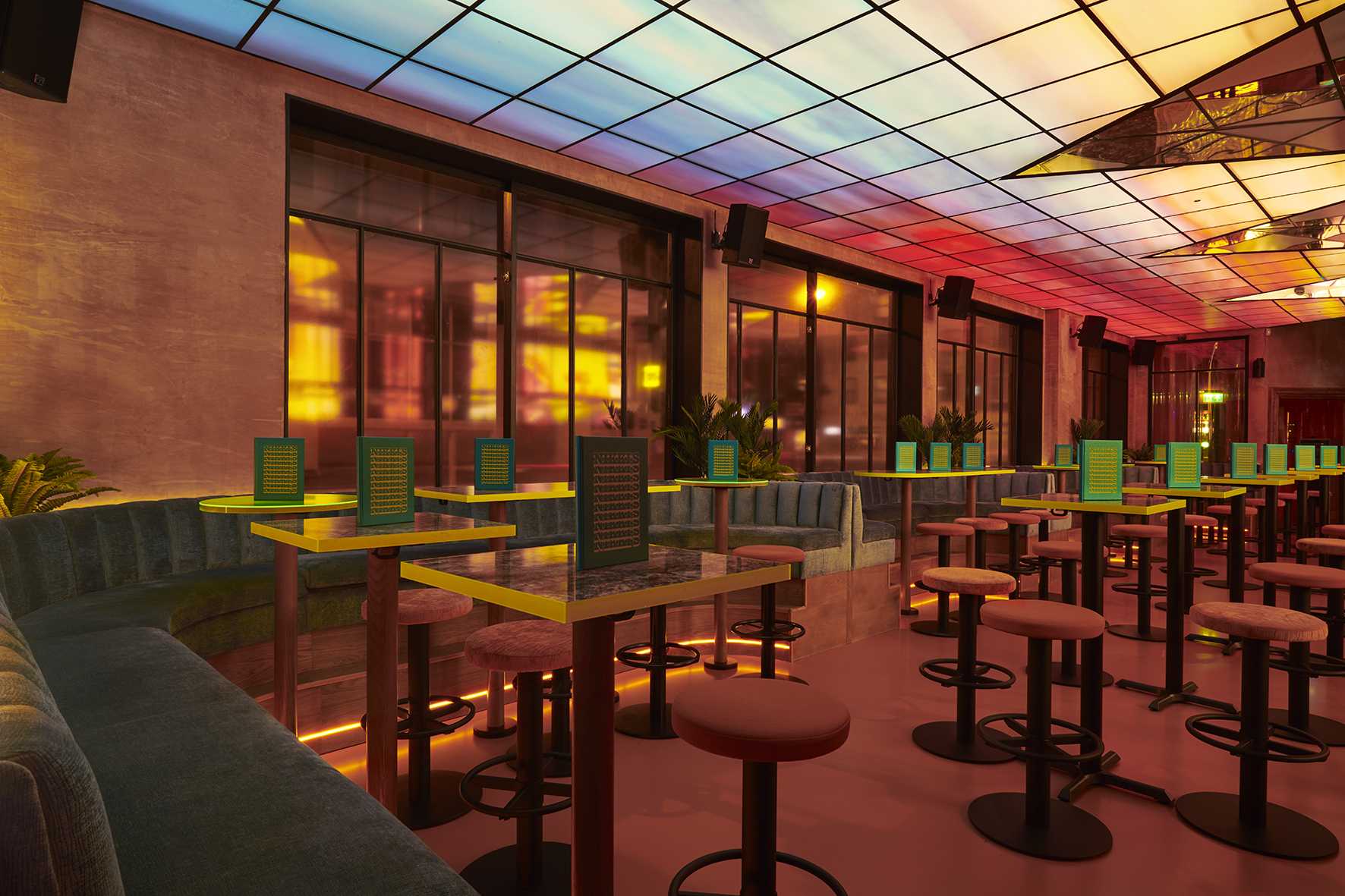 Modern event space at Nikki's with sleek seating and vibrant lighting for gatherings.