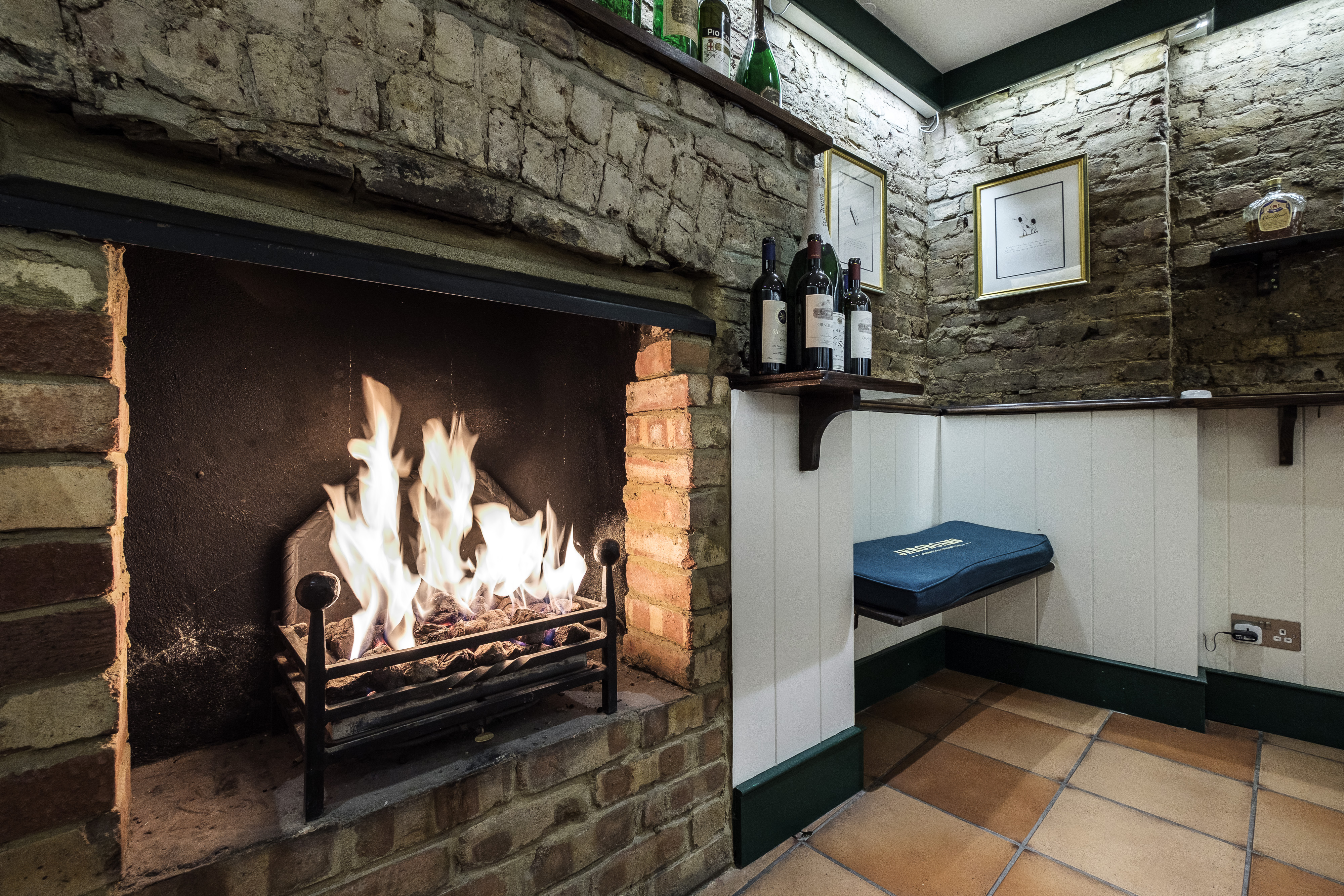 Cozy meeting space with fireplace in Jeroboams Walton Cellar for intimate gatherings.