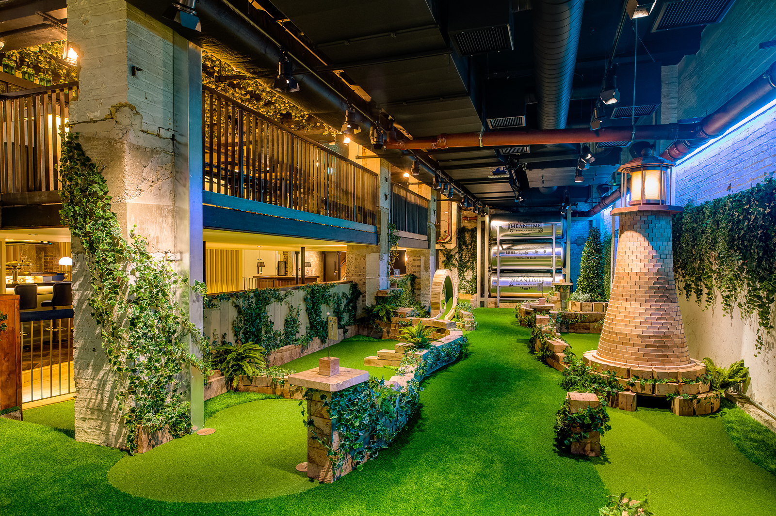 Indoor garden event space with lush greenery for networking and gatherings.
