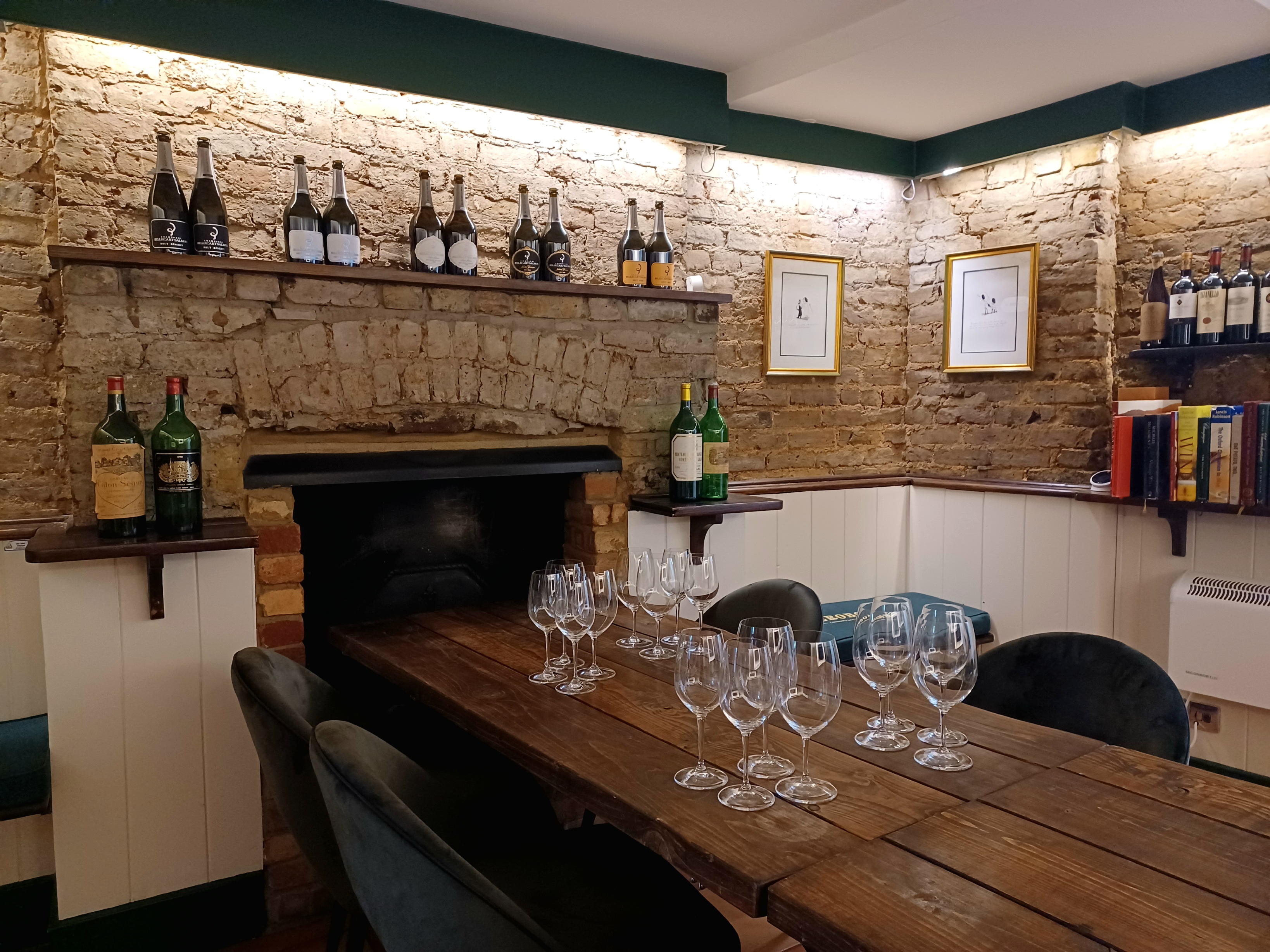 Cozy meeting space in Jeroboams Walton Cellar, ideal for wine tastings and gatherings.