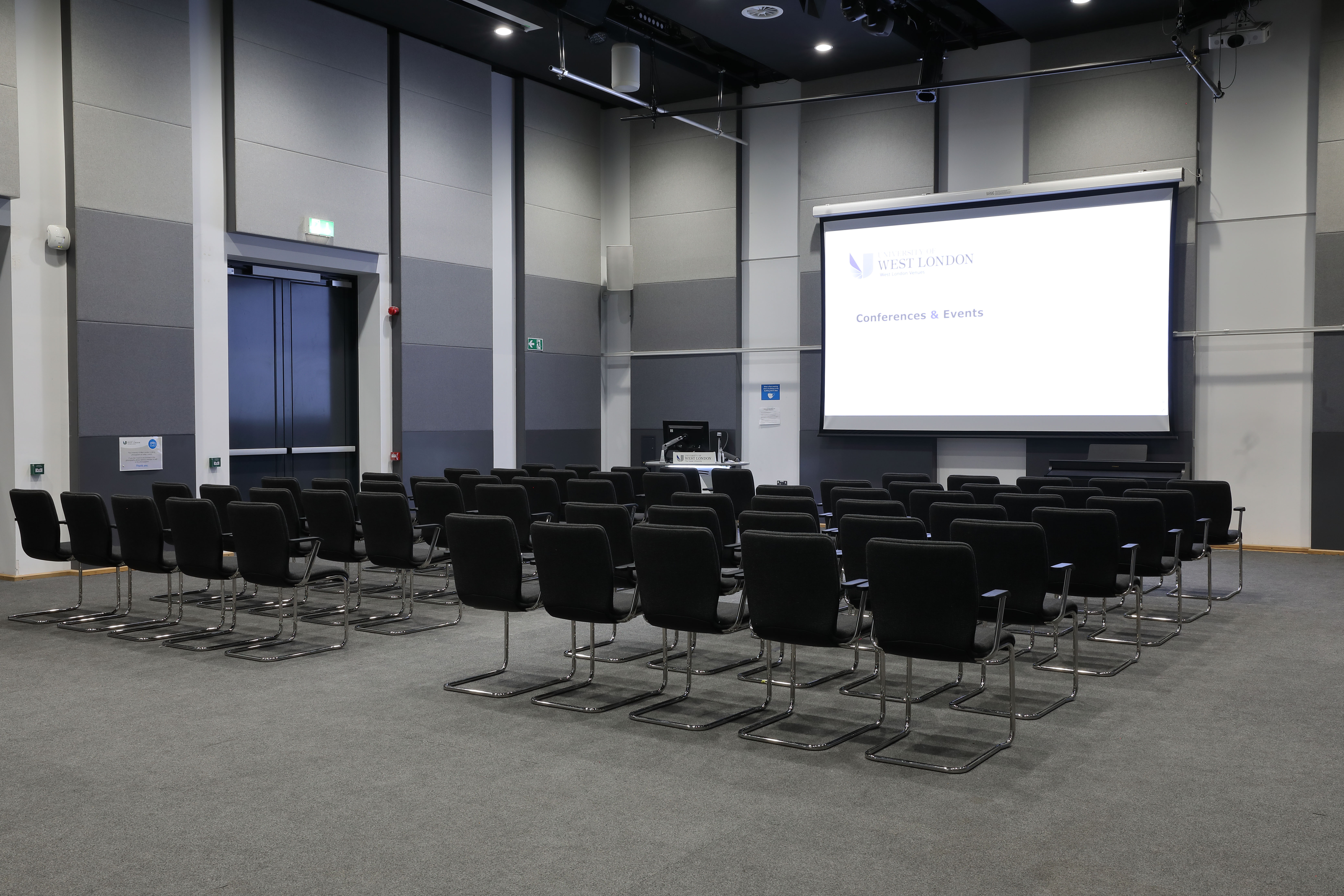 Weston Hall meeting space with black chairs, ideal for presentations and workshops.