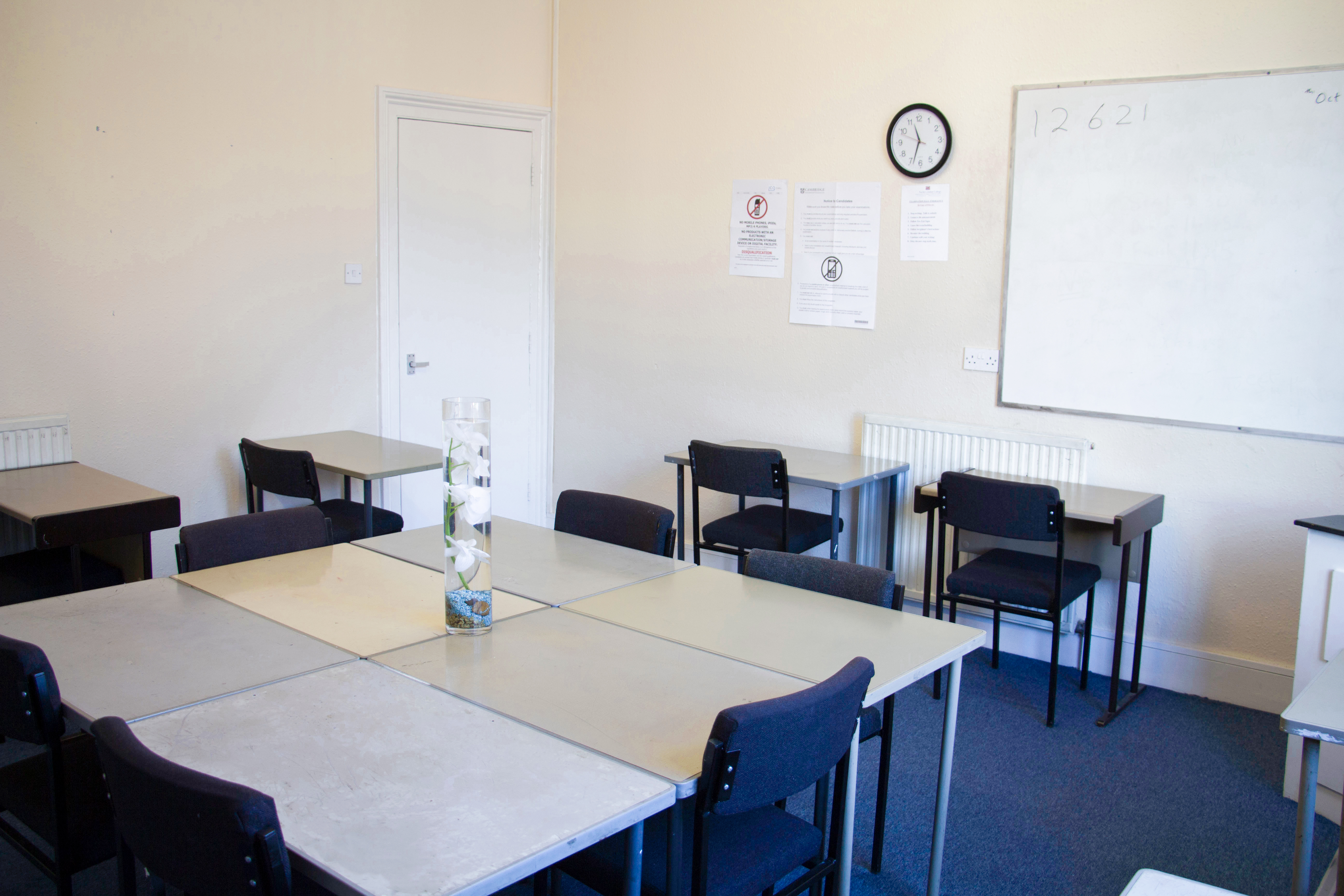 Meeting Room 102 at North London College, featuring tables for workshops and training sessions.