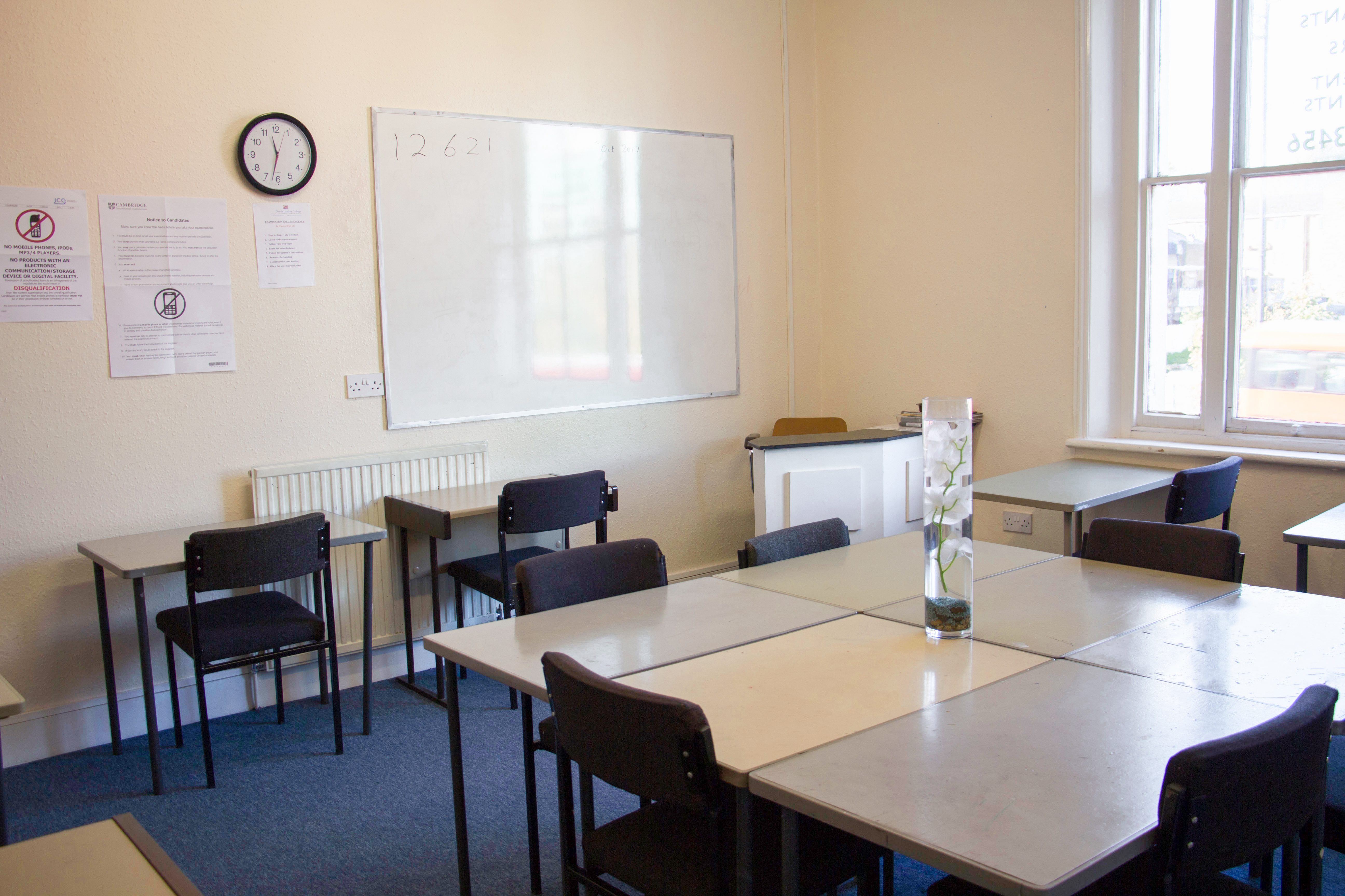 Versatile Meeting Room 102 with natural light, perfect for training sessions and workshops.