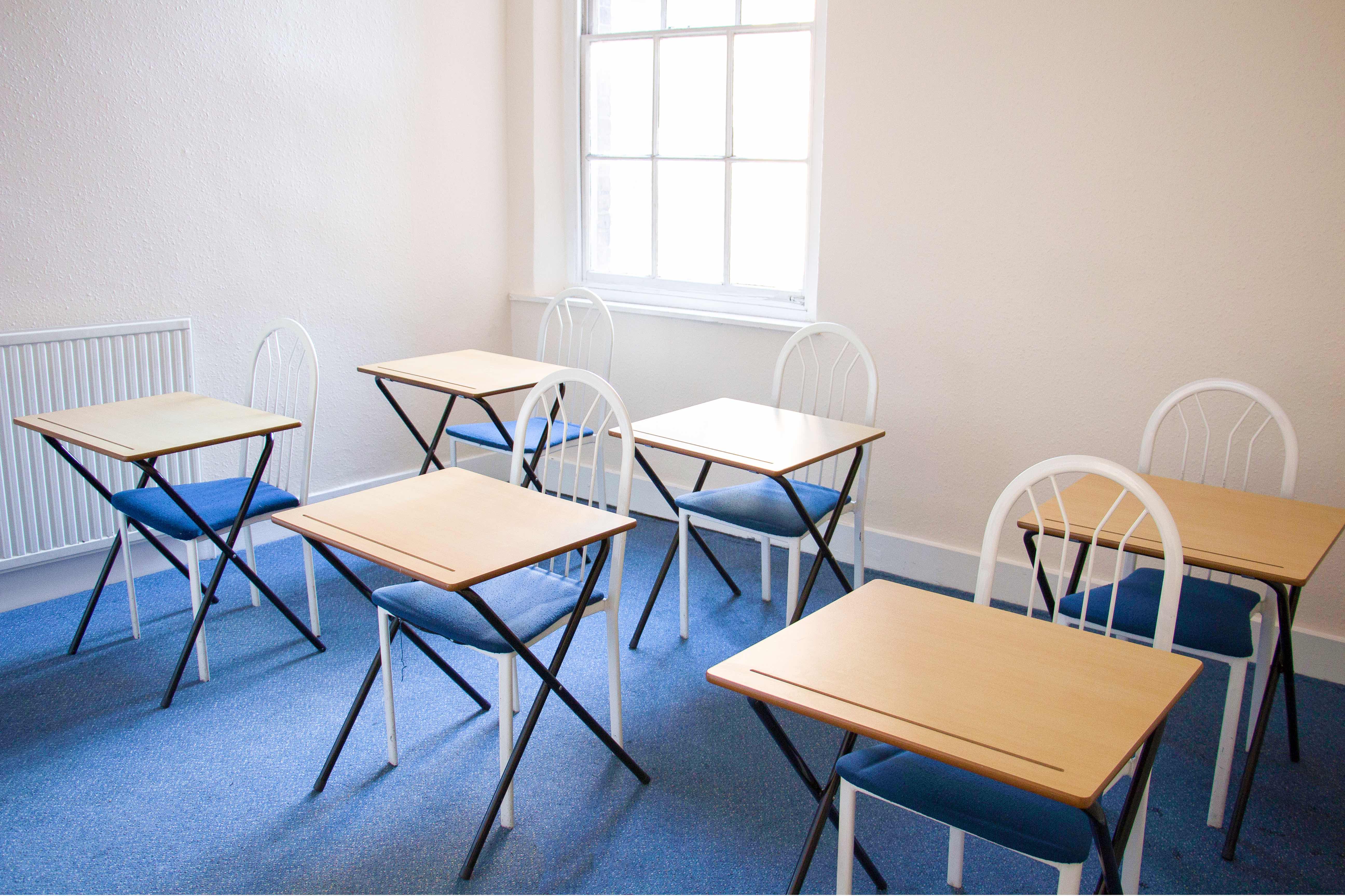 Meeting Room 103 at North London College, flexible seating for workshops and discussions.