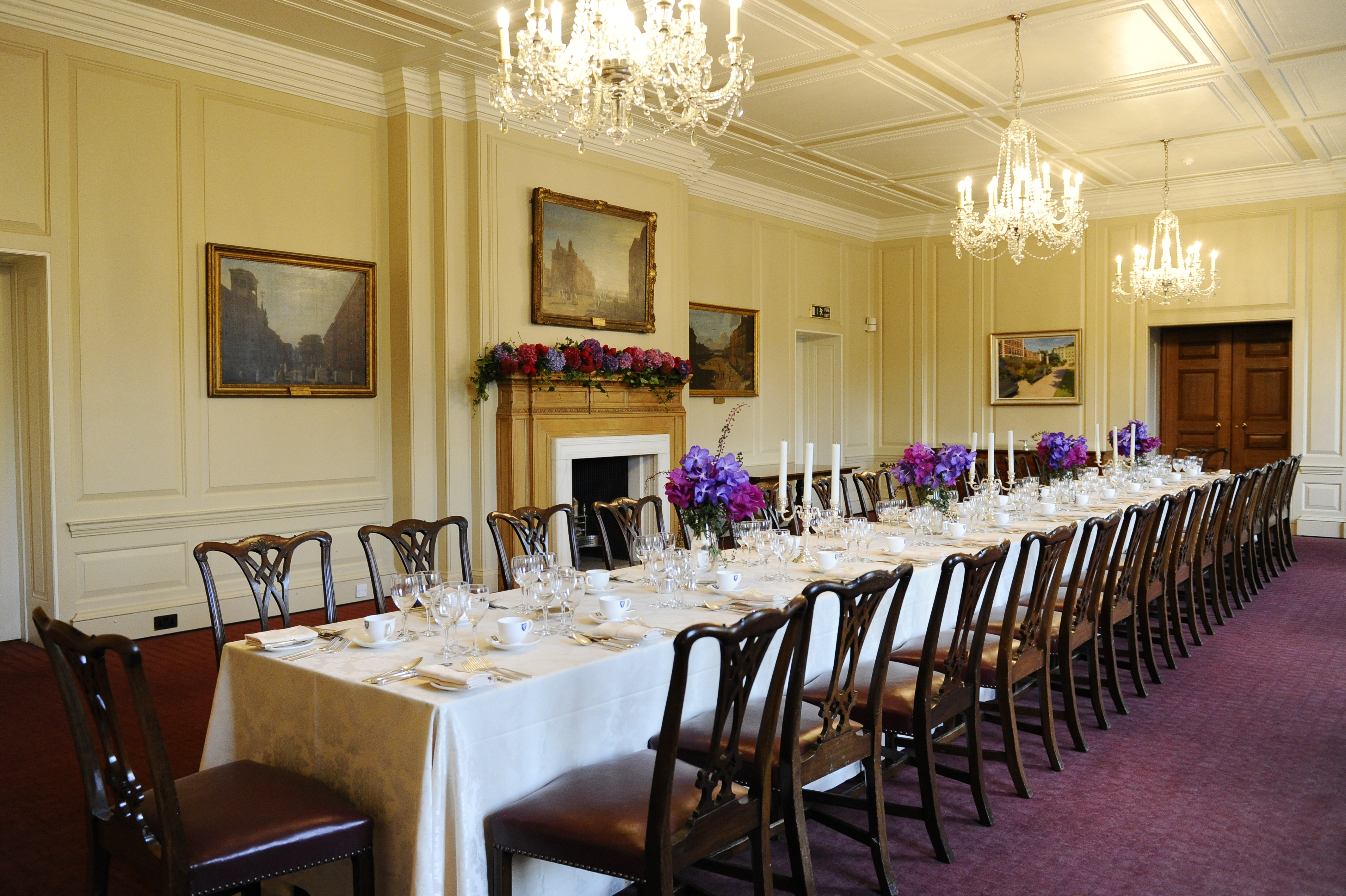 Elegant Luncheon Room with floral centerpieces, ideal for corporate events or meetings.