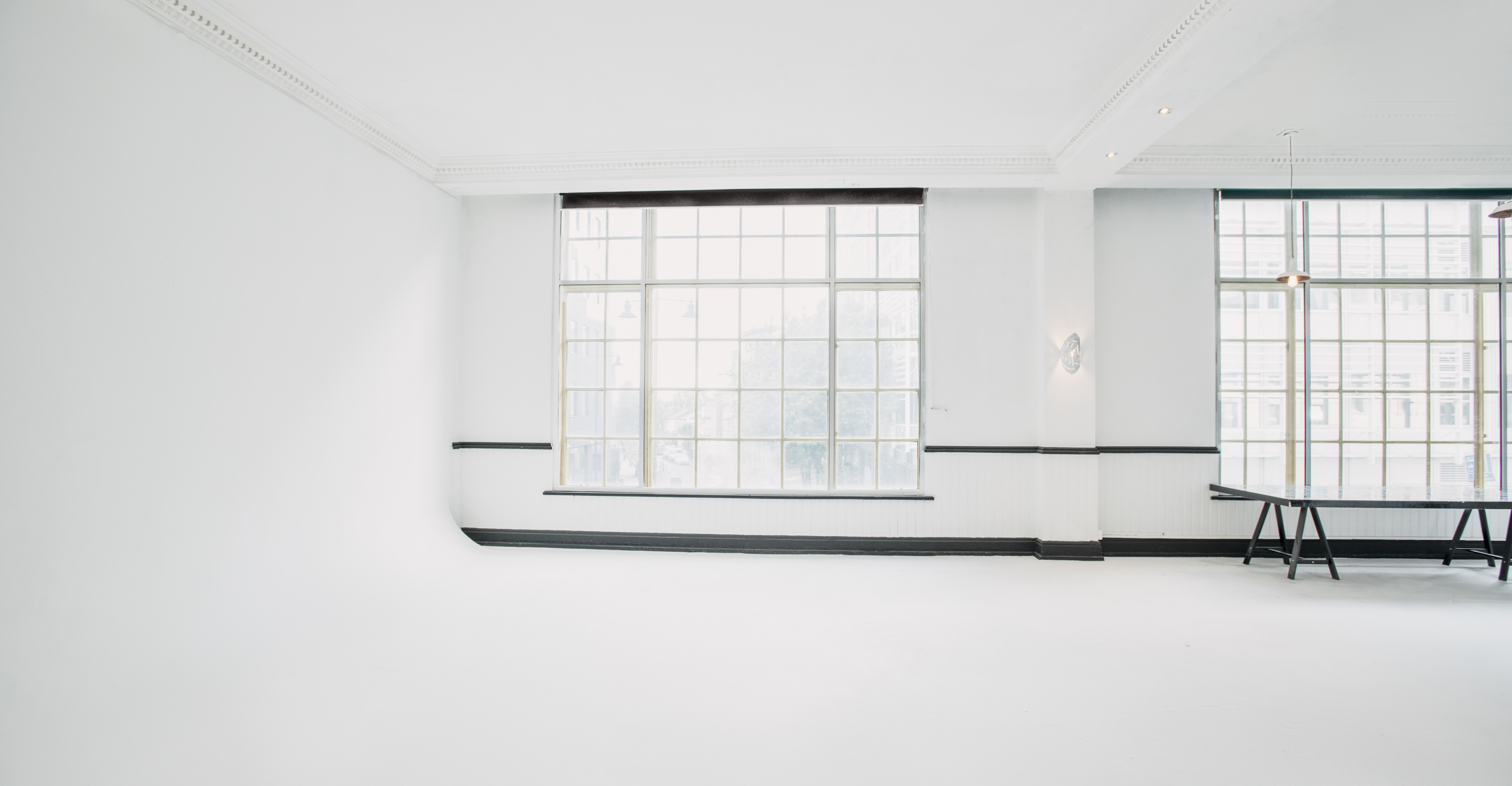 Bright minimalist event space with large windows in PS Spaces, Wimbledon Studio.