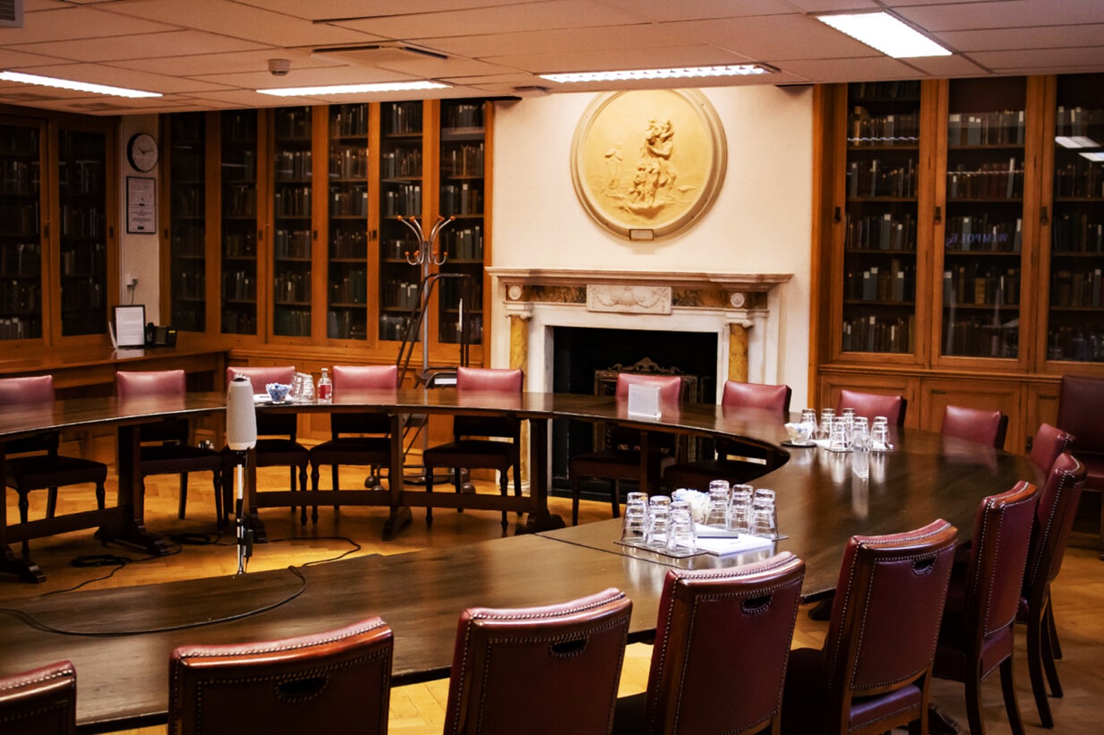Marcus Beck Library meeting room with circular table, ideal for board meetings and retreats.
