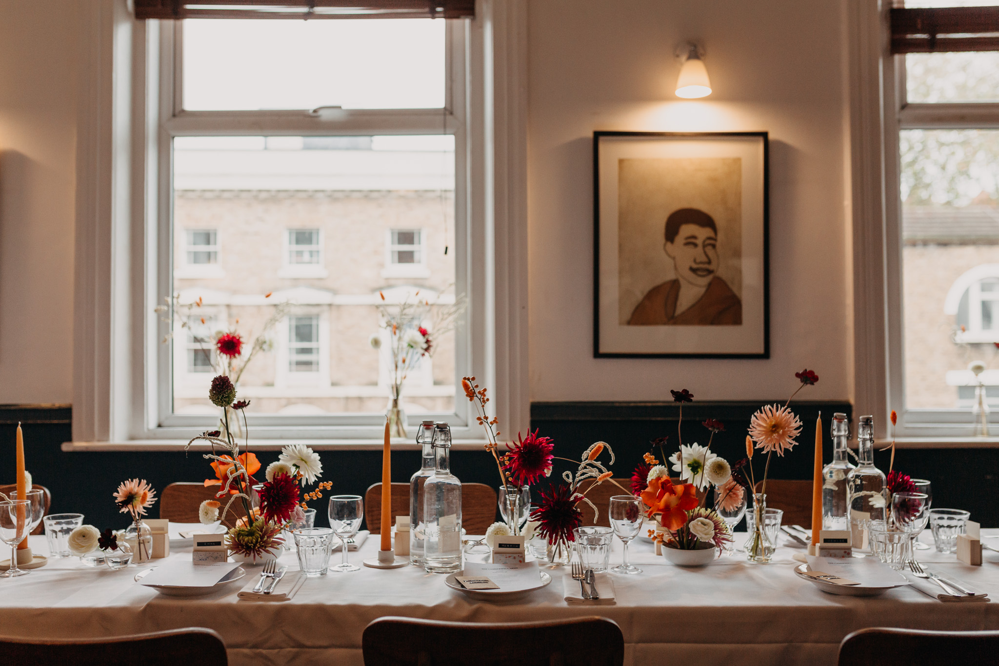 Elegant dining table with floral centerpieces for intimate events at The Camberwell Arms.