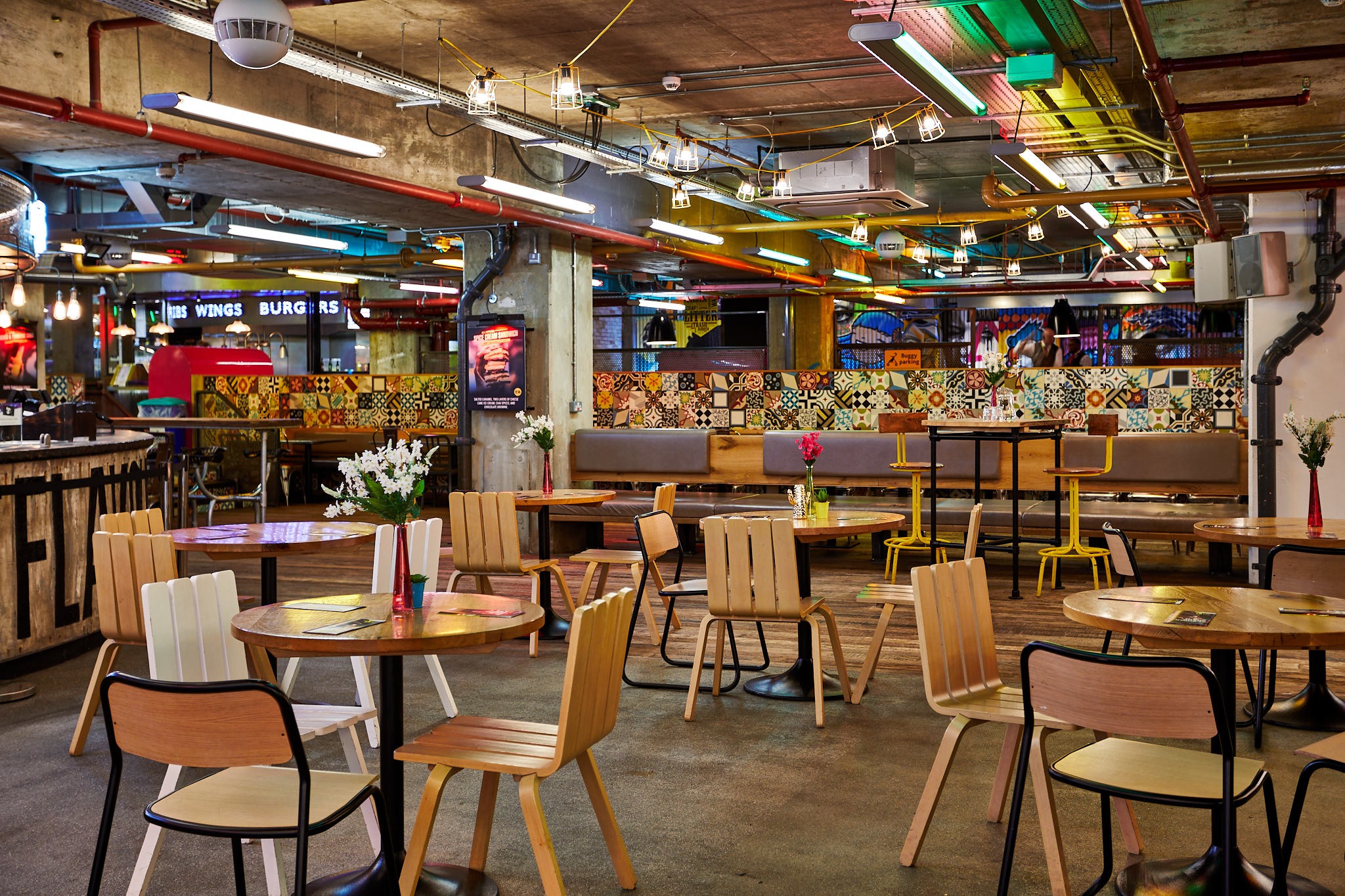 Vibrant urban courtyard in Trinity Kitchen, ideal for casual meetings and networking events.