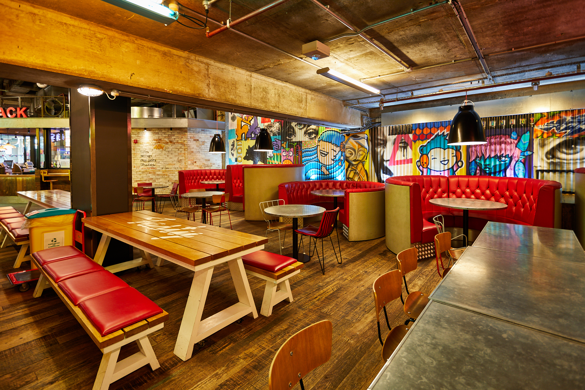 Vibrant urban courtyard with eclectic decor, ideal for events and gatherings.