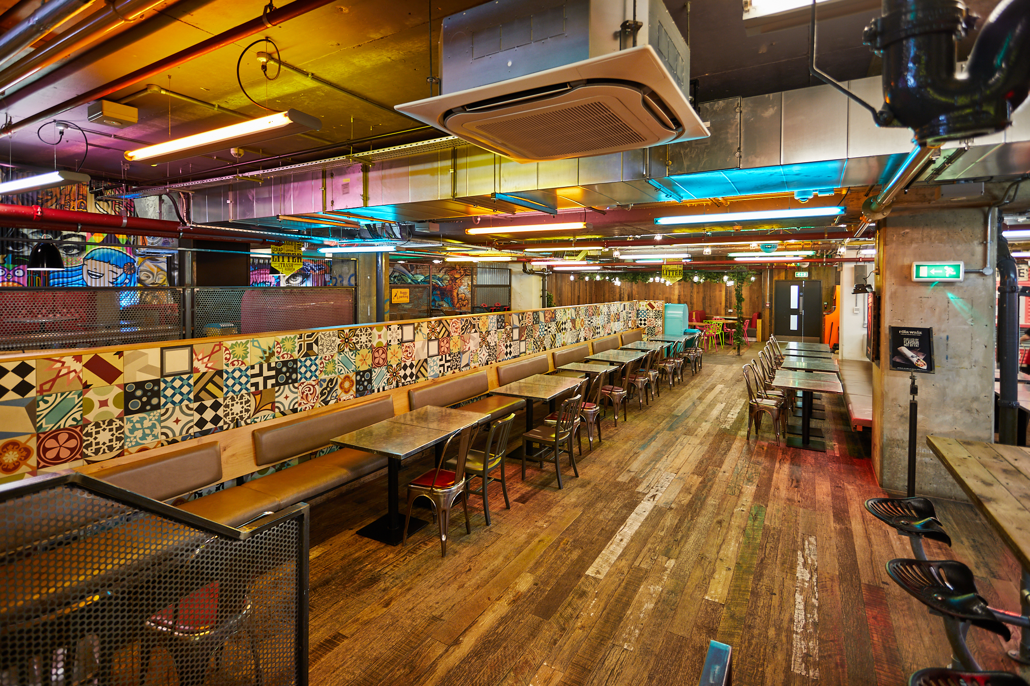 Vibrant urban courtyard with colorful tiles, perfect for events and gatherings.