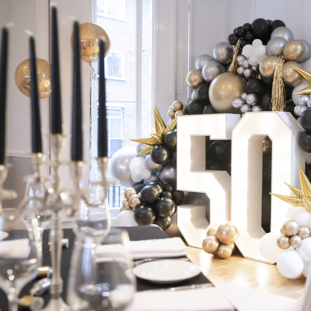 Ballroom at Linden House with elegant decor for a 50th milestone celebration.