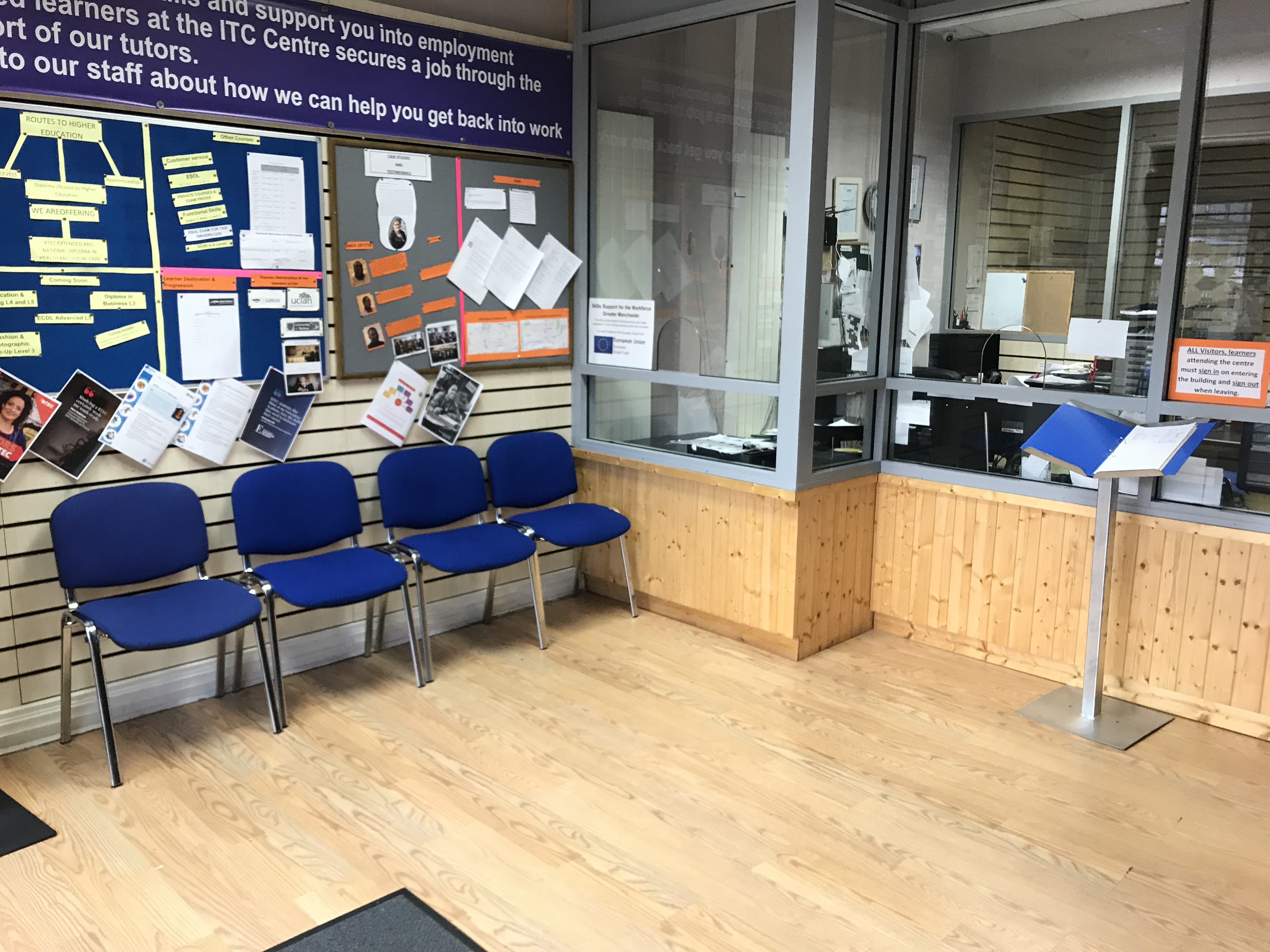 Jilani Hall waiting area with blue chairs, ideal for briefings and consultations.